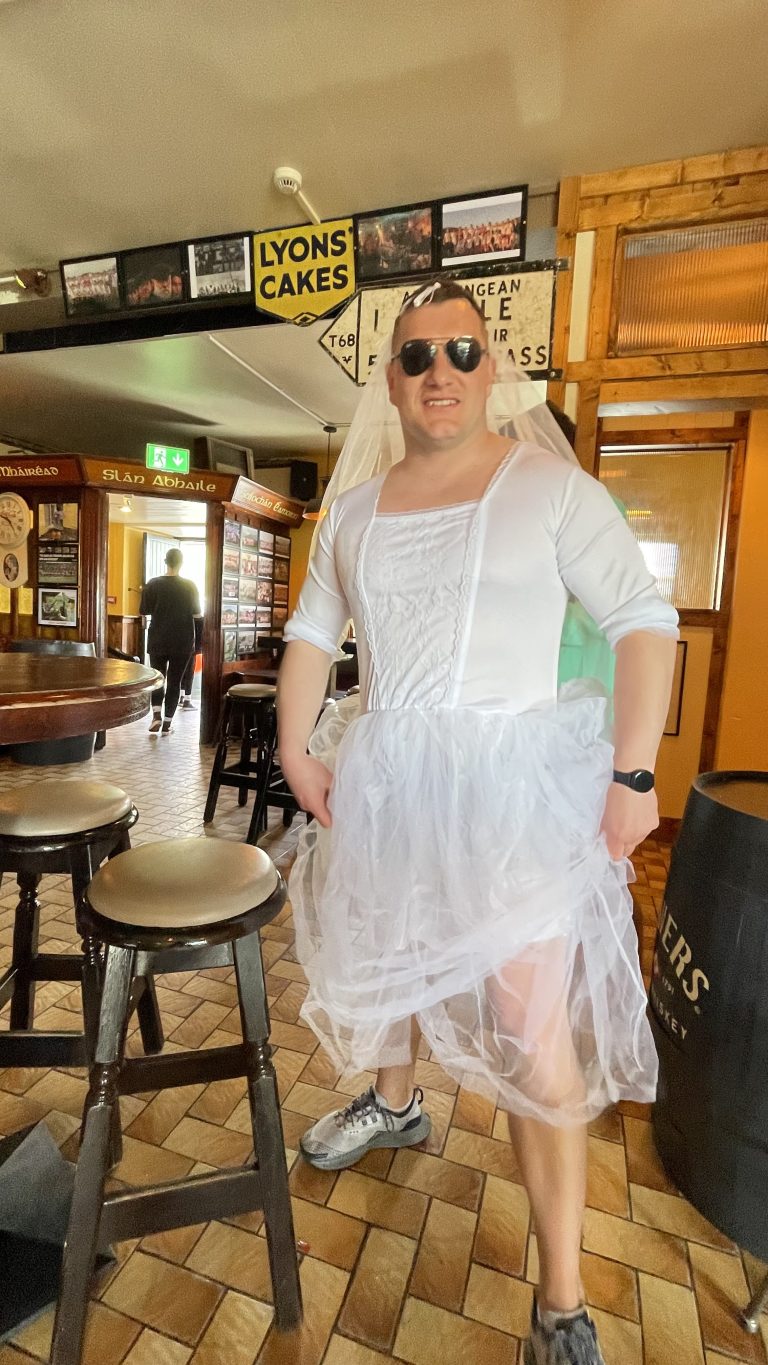 Bachelor party at Krugers Pub on the Dingle Way, groom wearing a wedding dress inside the most westerly pub in Europe.