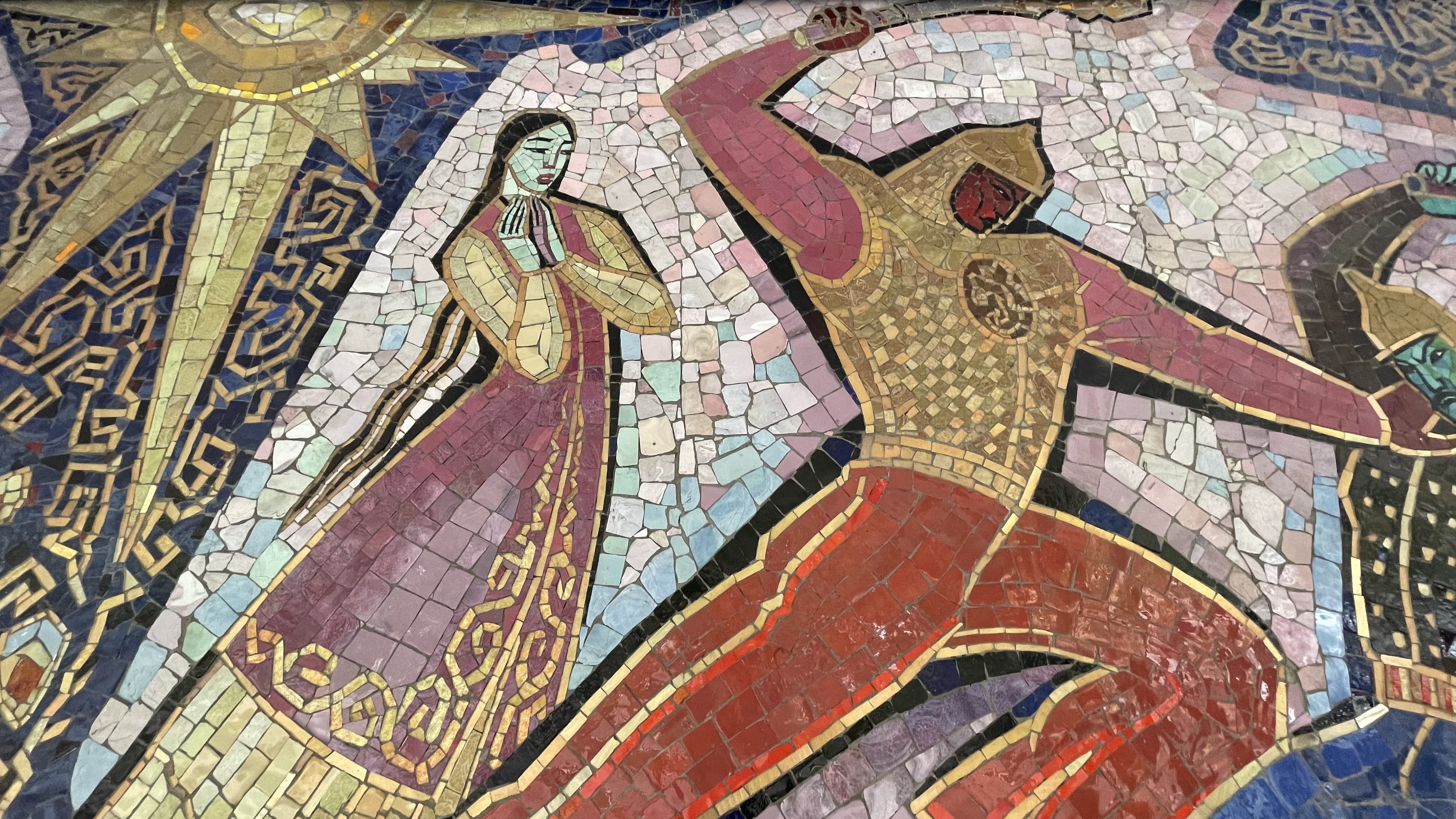 Five-panel mosaic on the façade of Hotel Almaty depicting figures from a Kazakh folk tale, created in 1965 as part of the city’s Soviet-era monumental art