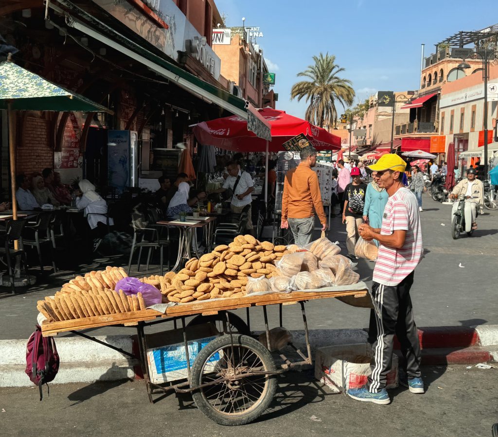 Bread seller with cart stacked high at Jemaa el-Fnaa square, Marrakech – 2 Days in Marrakech.