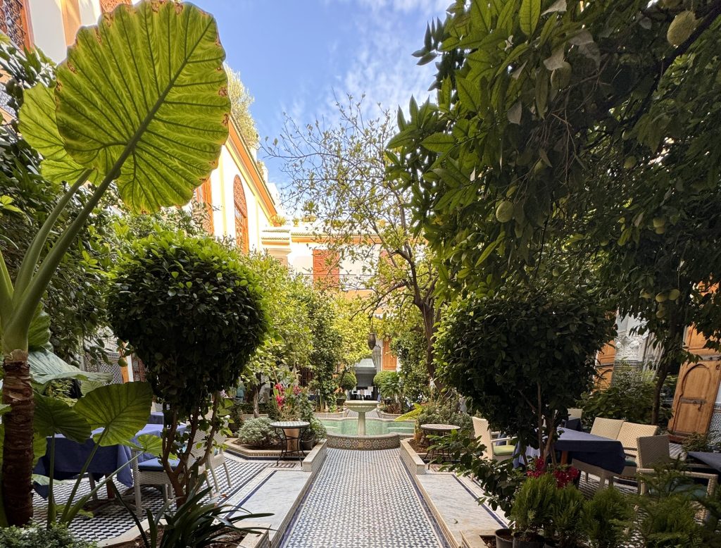 The peaceful courtyard at Eden at Palais Amani, our riad in Fes. Mosaic tiles, citrus trees, and a fountain created the perfect spot to unwind after exploring the medina.