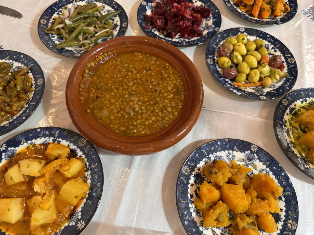 Moroccan meal with lentil tagine and assorted cooked vegetable salads, photographed during 2 Days in Fes.