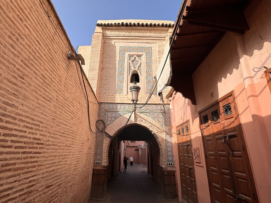 Ornate Moroccan archway with zellige tile and lantern in the Marrakech medina – 2 days in Marrakech.