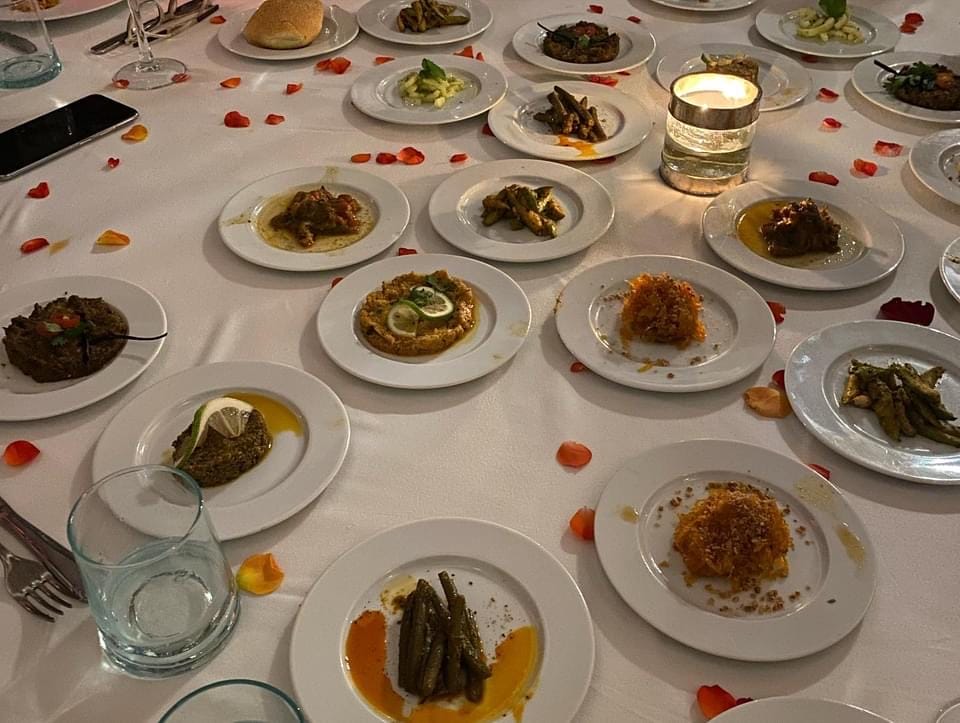 A spread of Moroccan salads and small appetizers including eggplant, olive spread, carrot with honey, green beans, and cucumber – 2 Days in Marrakech.