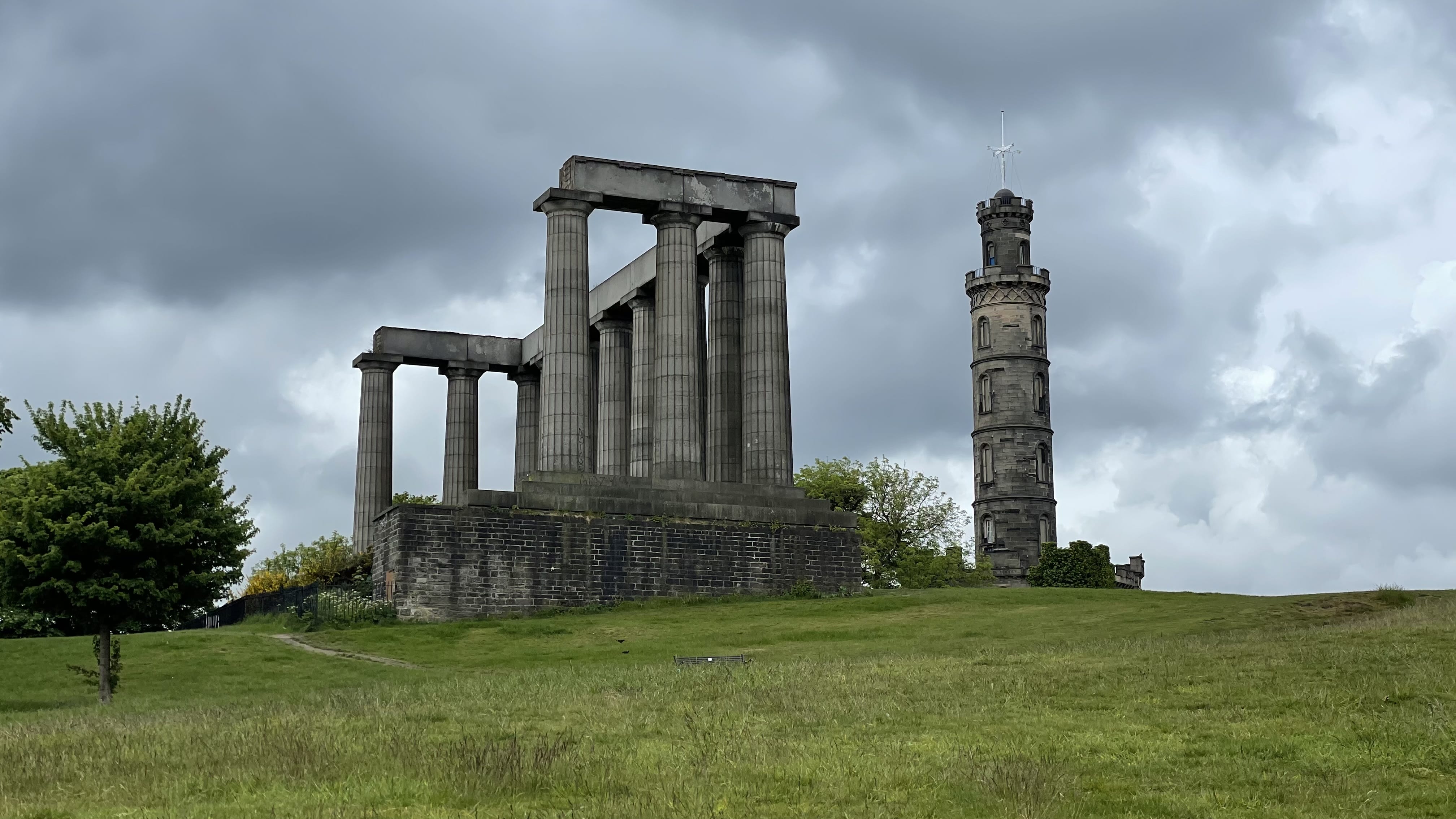 The National Monument and Nelson Monument on Calton Hill, a classic stop during 4 days in Edinburgh, Scotland.