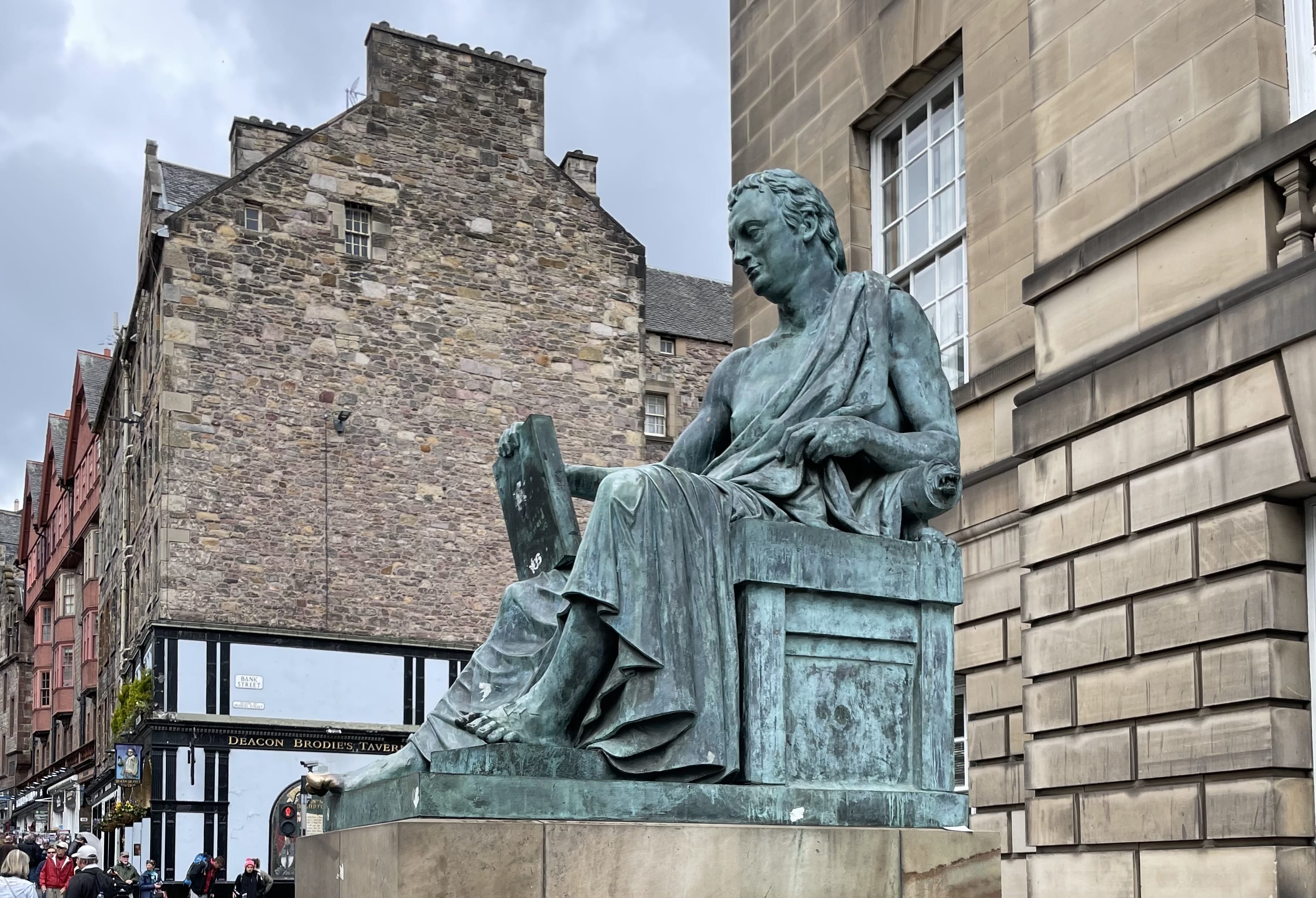 Bronze statue of philosopher David Hume on the Royal Mile in Edinburgh, a historic landmark included in 4 days in Edinburgh itinerary.