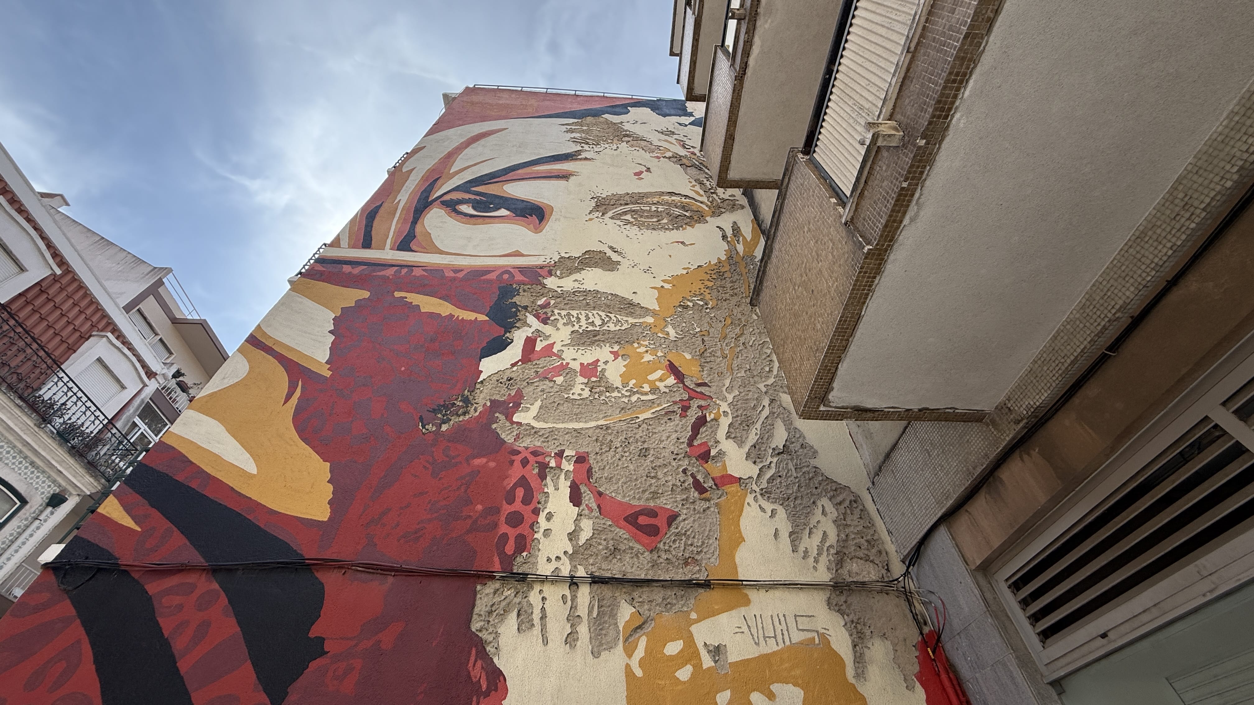 Collaborative mural in Lisbon by Portuguese street artist Vhils and American artist Shepard Fairey, titled Universal Personhoo