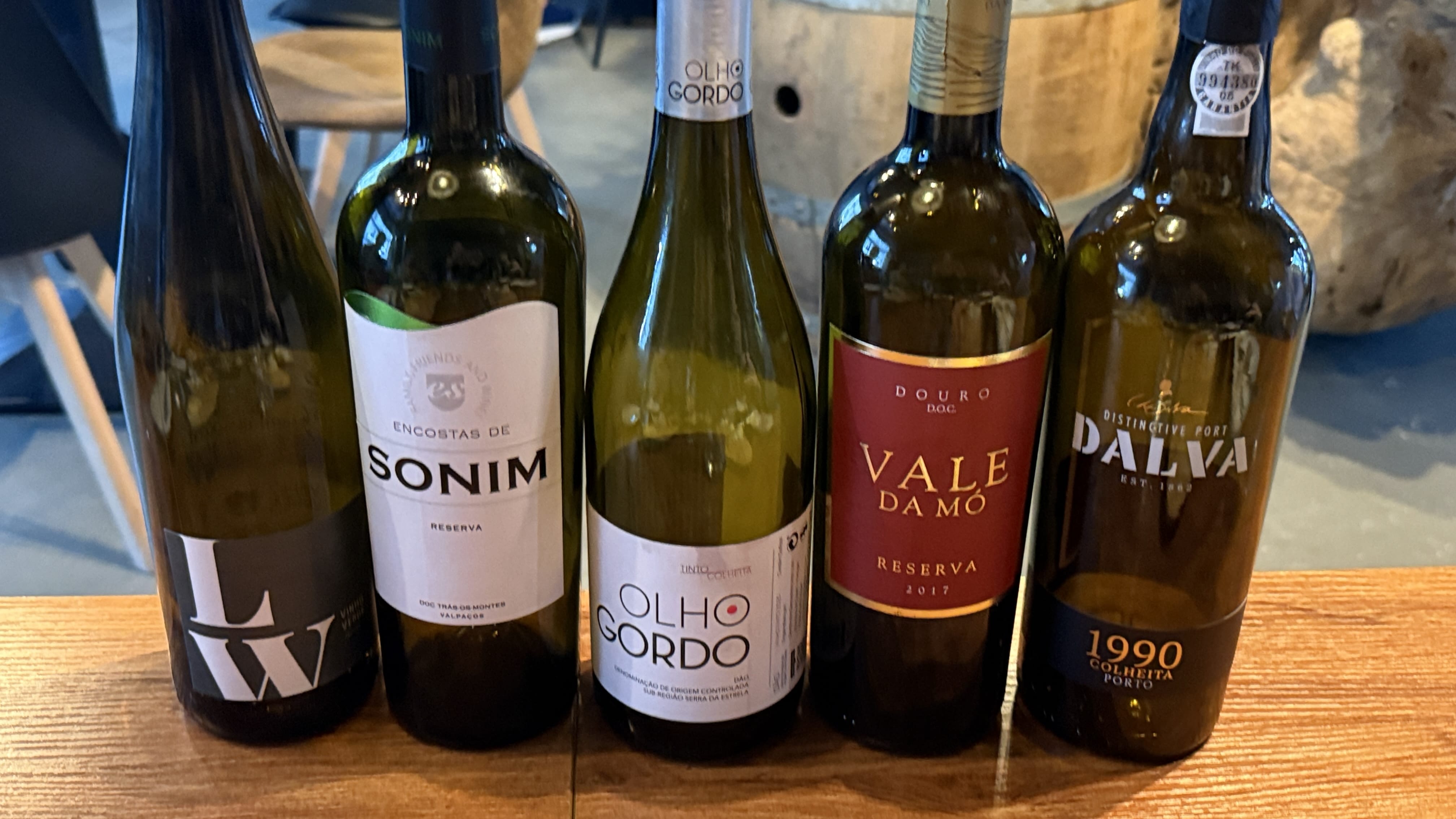 Lineup of five Portuguese wine bottles including Sonim Reserva, Vale da Mó, Olho Gordo, and Dalva Port.