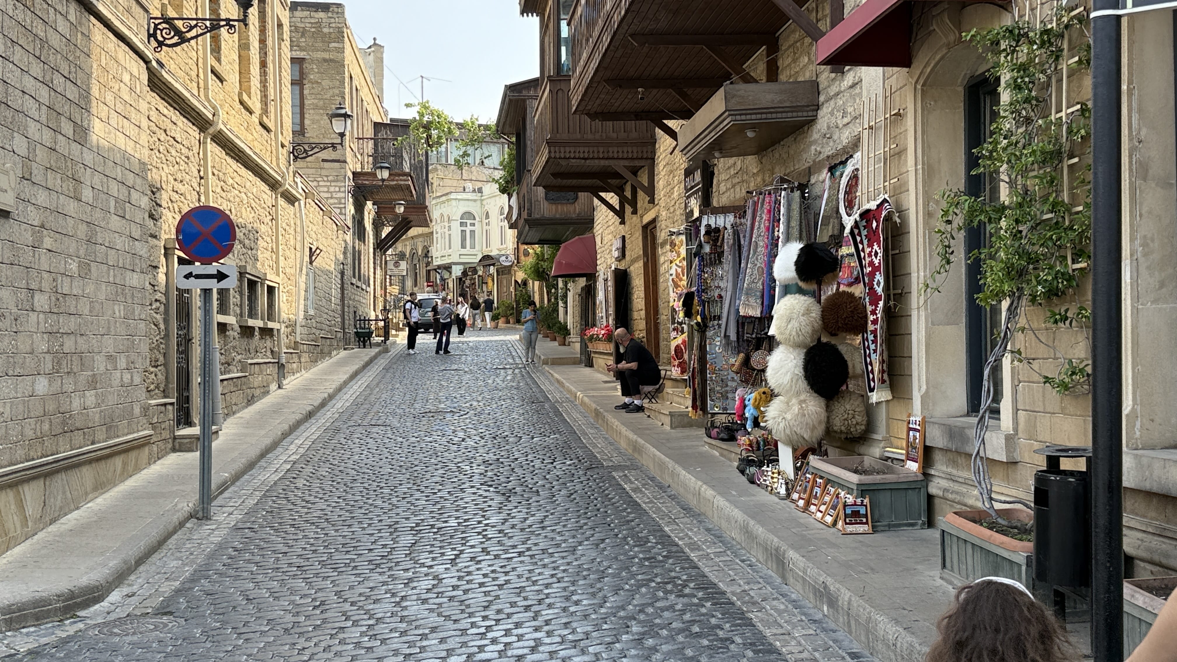 Narrow cobblestone street in Baku’s Old City lined with shops and local crafts — 7 Days in Azerbaijan Old Town photo.