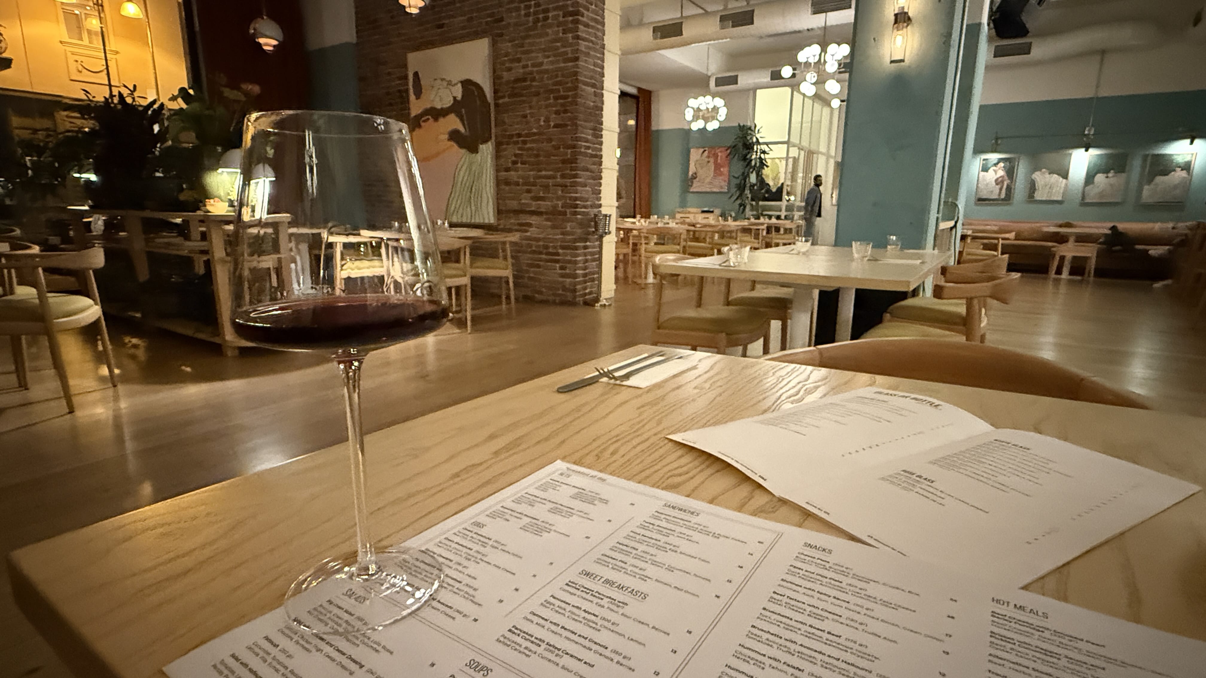 Quirky cat sculptures peeking from a stone window in Baku’s Old City, Azerbaijan — 7 Days in Azerbaijan city details.