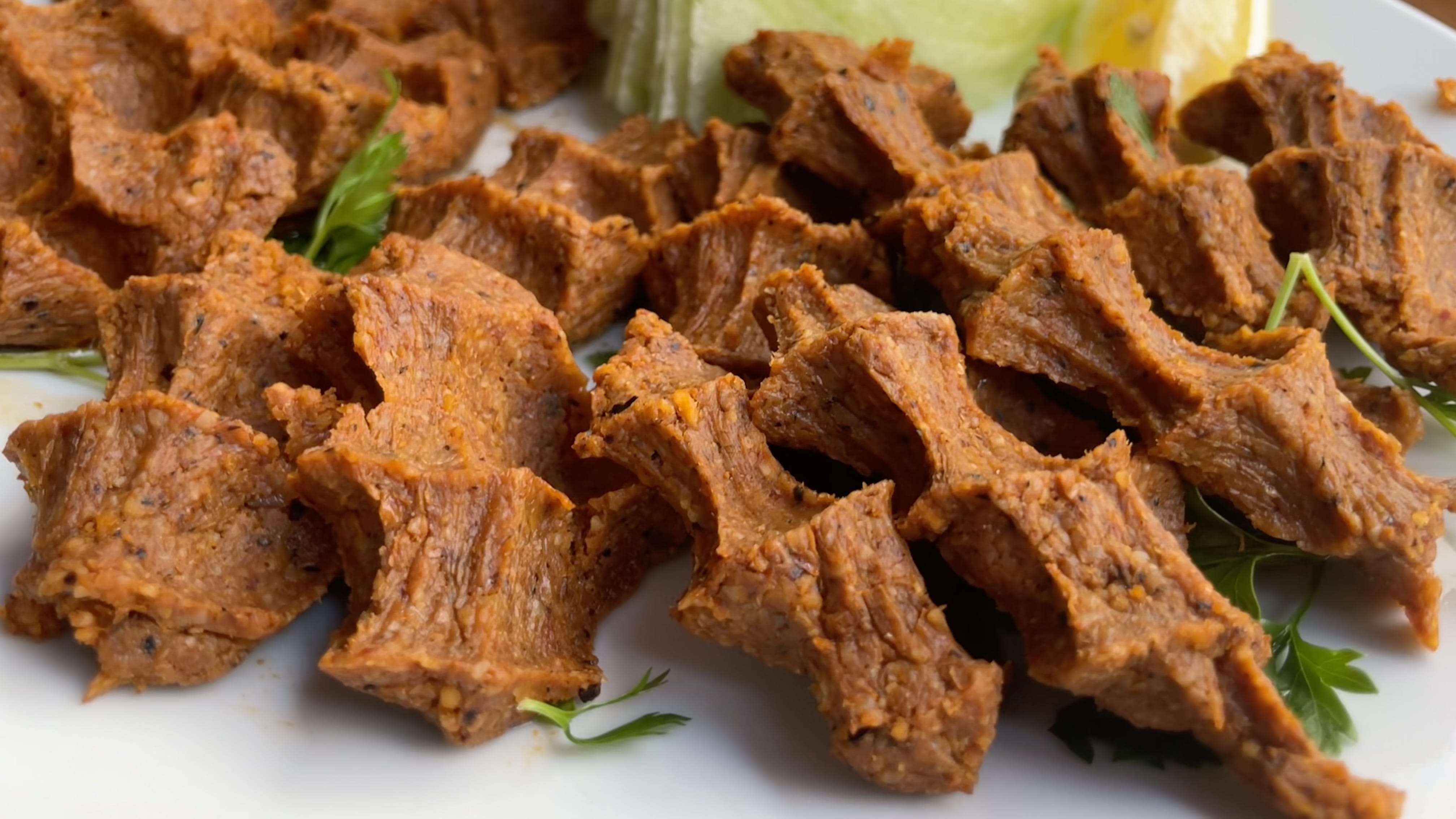 Plate of vegetarian çiğ köfte made with bulgur vegetarian food in Istanbul.