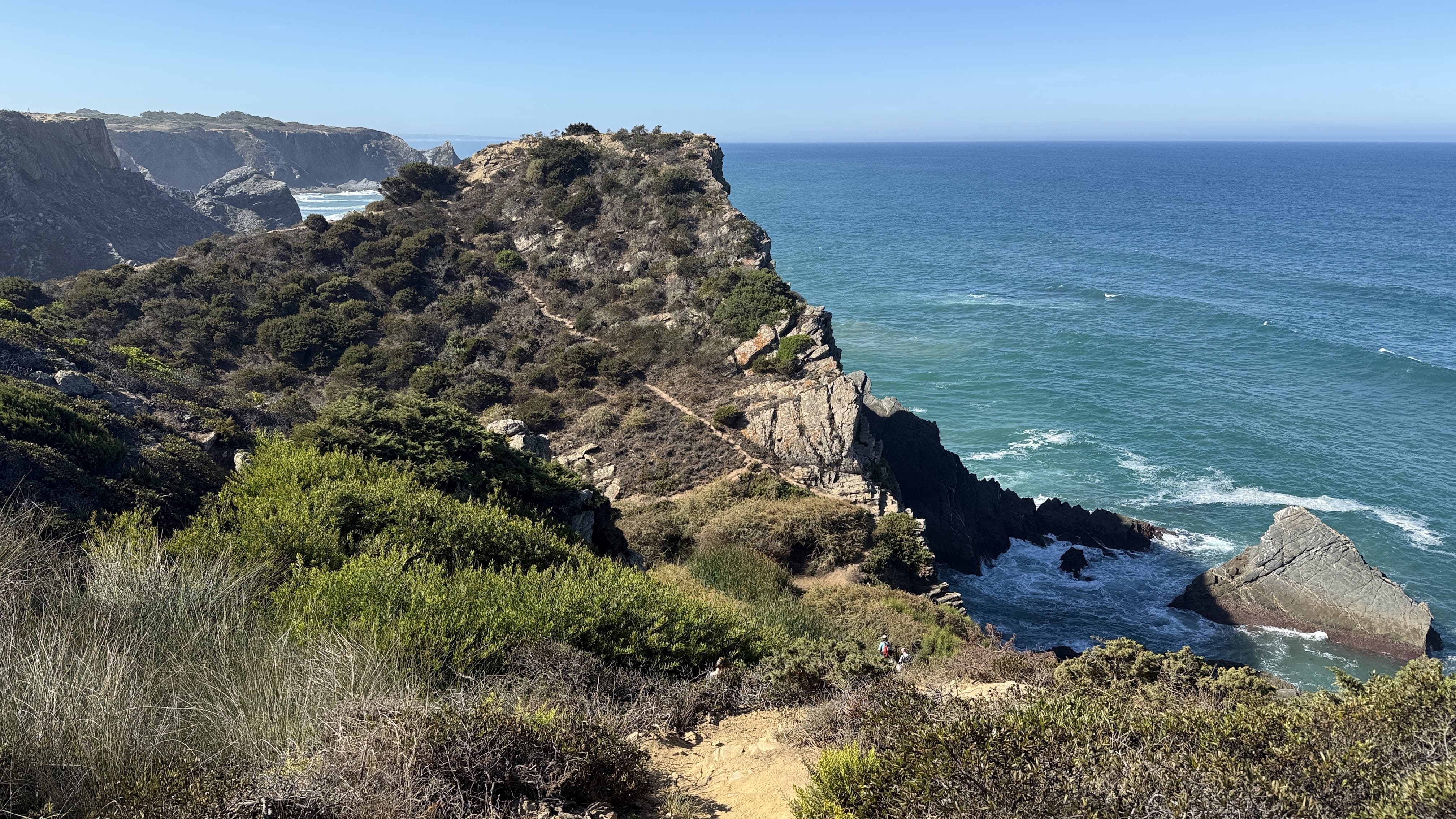 Narrow trail winding along a cliffside above the Atlantic Ocean on Day 5 of the Fishermen’s Trail, Portugal.
