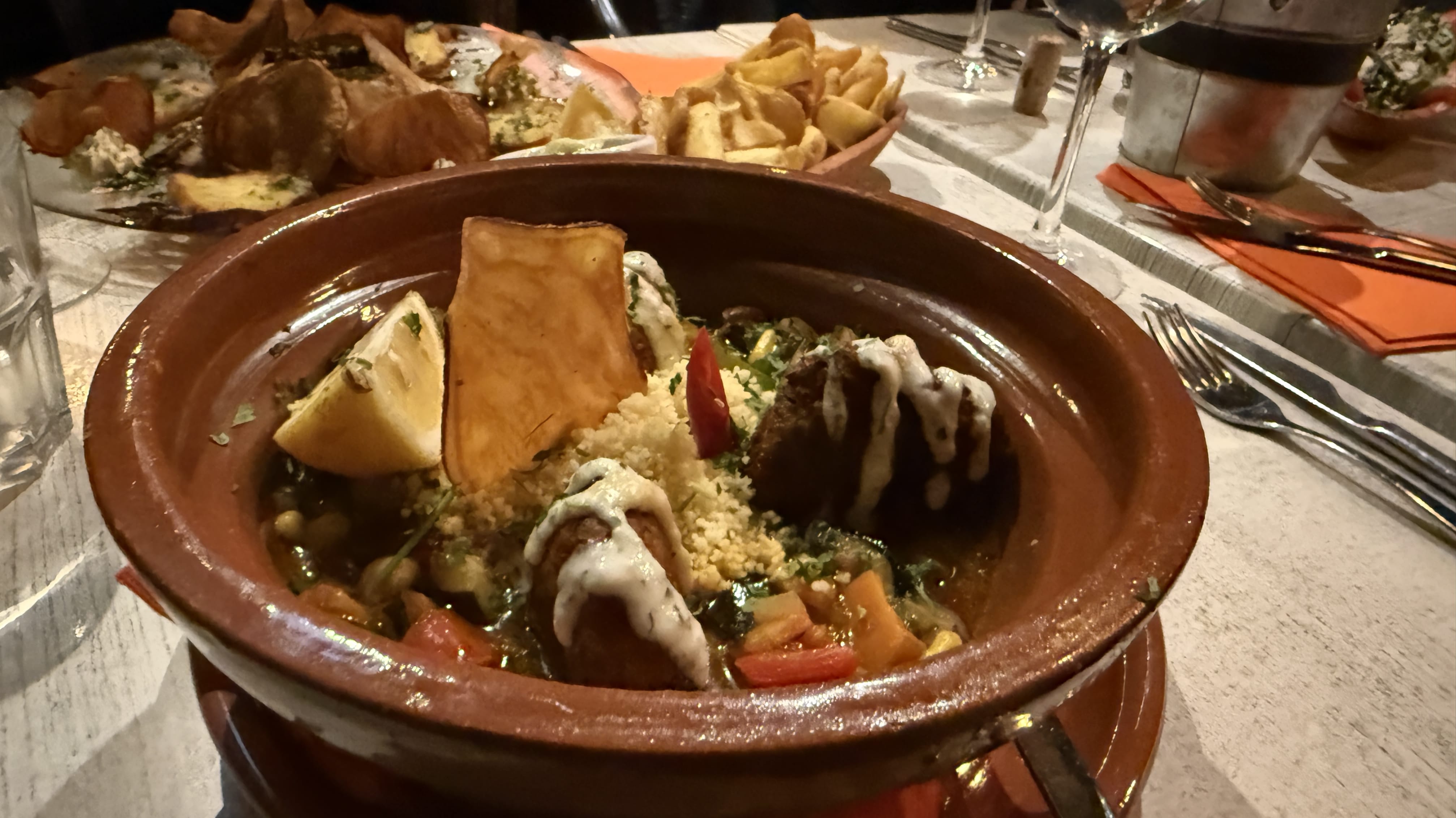 Vegetarian tagine with couscous, falafel, and vegetables served in Aljezur, Portugal.