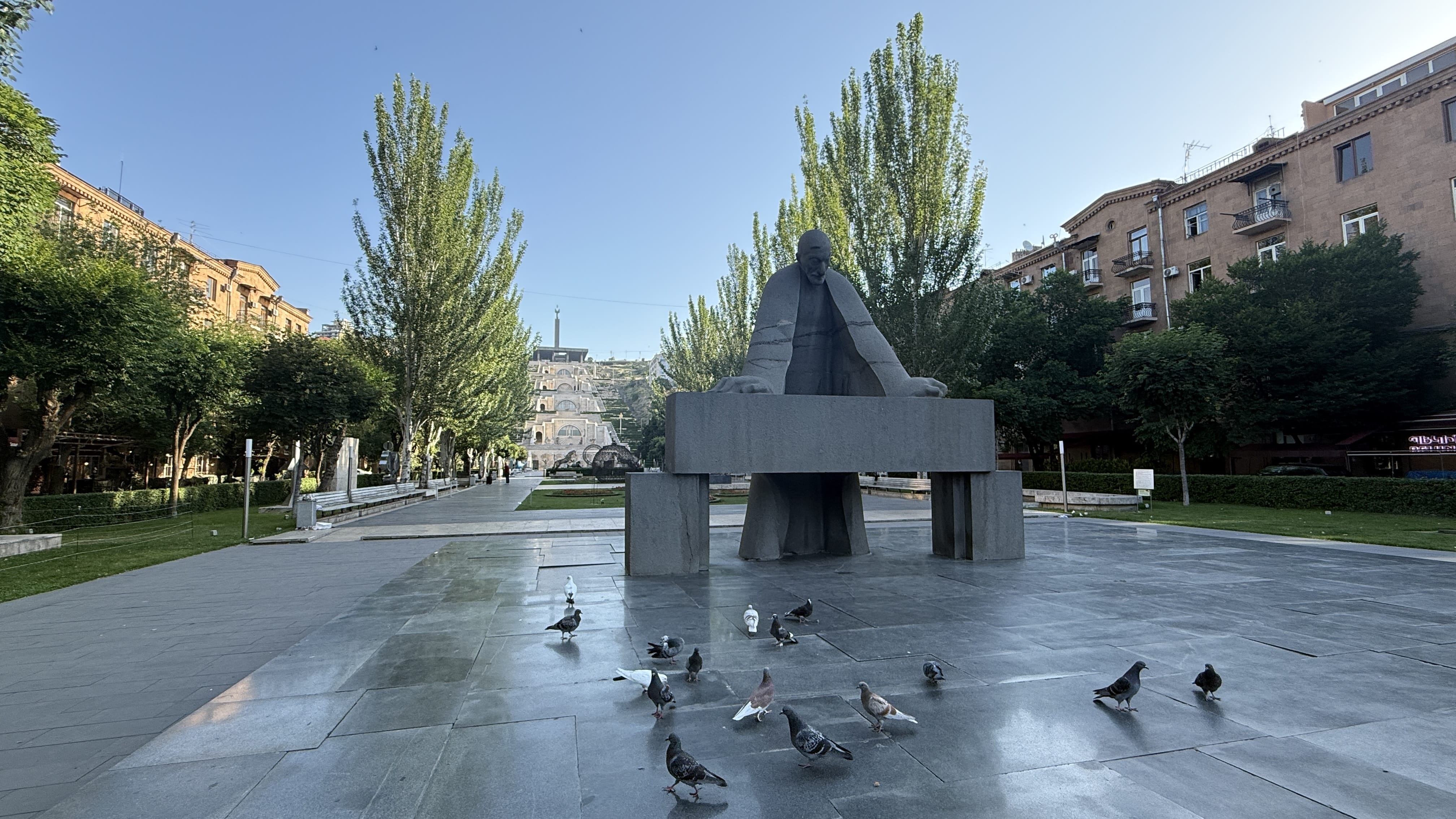 Statue of Armenian writer Alexander Tamanyan with pigeons in front of Cascade Complex in Yerevan – 7 Days in Armenia blog