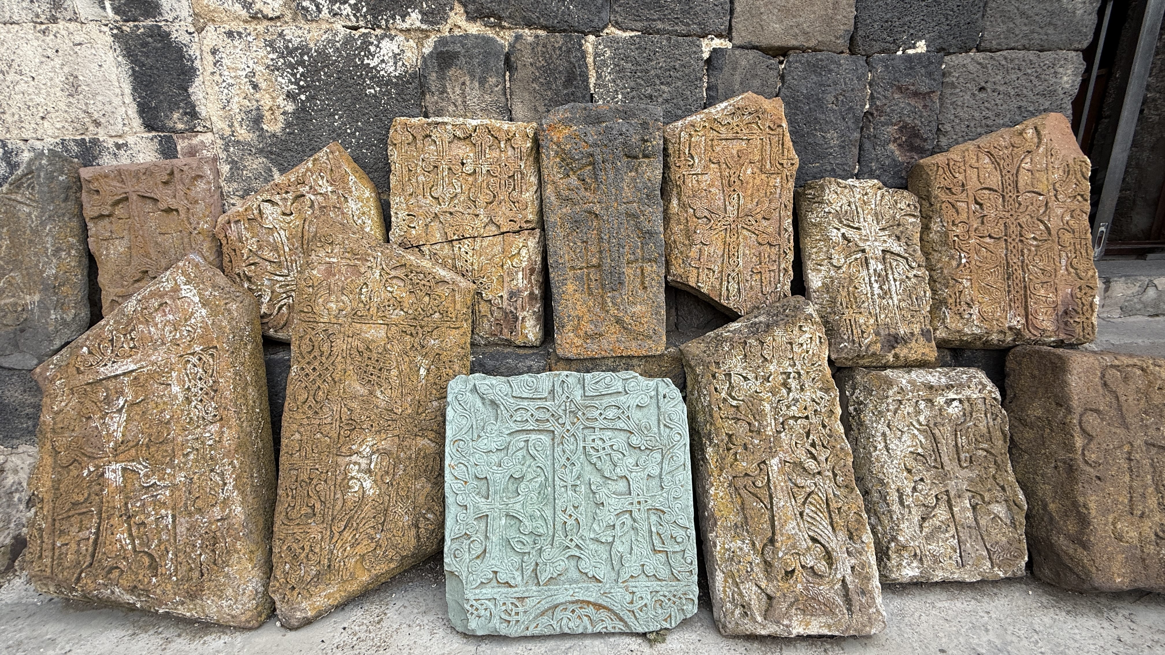 Collection of historic khachkars stacked outside Sevanavank, seen during seven days in Armenia.