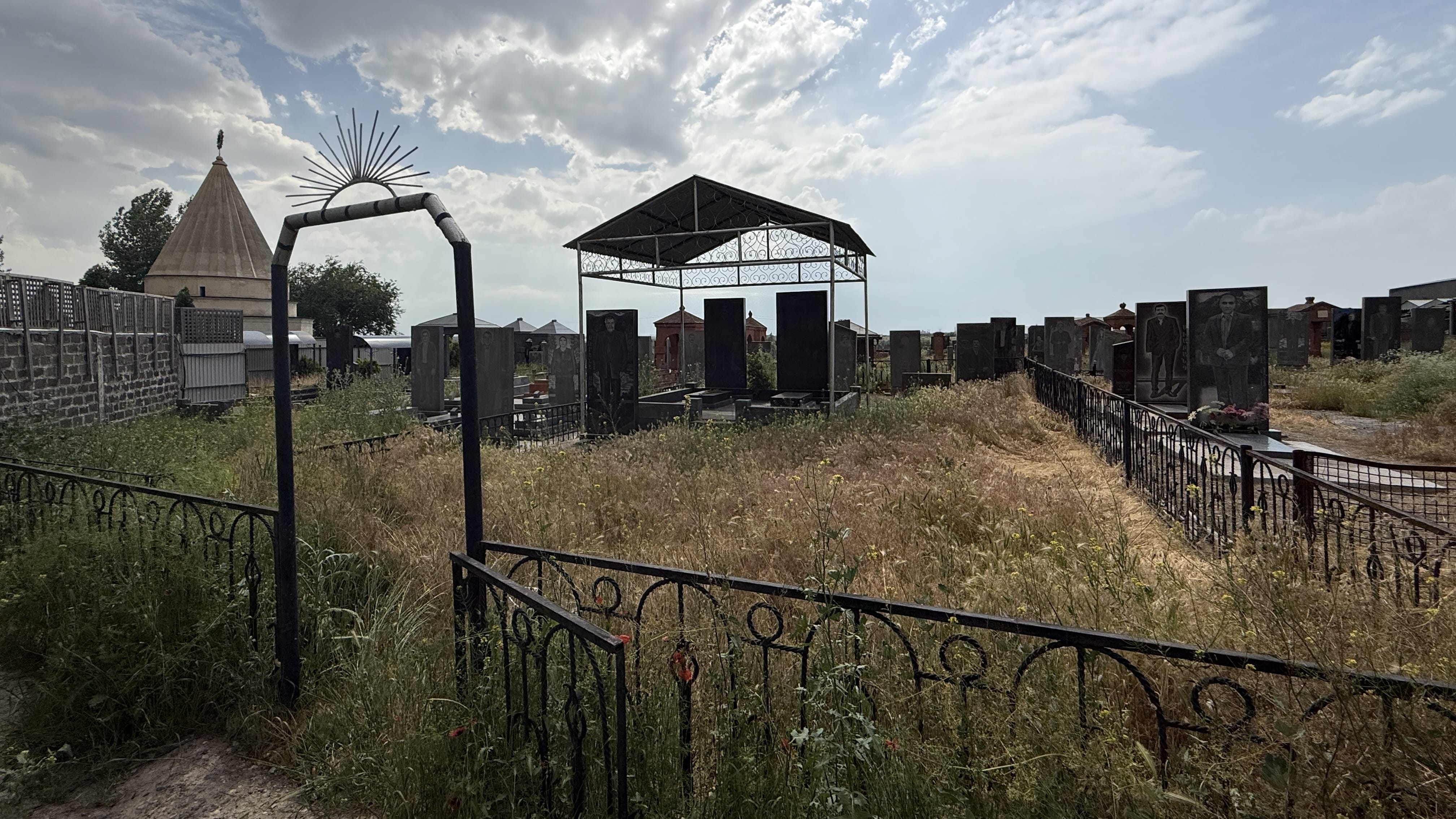 Gravestones and monuments at the Yazidi cemetery next to Aknalich Temple in Armenia, photographed during seven days in Armenia.