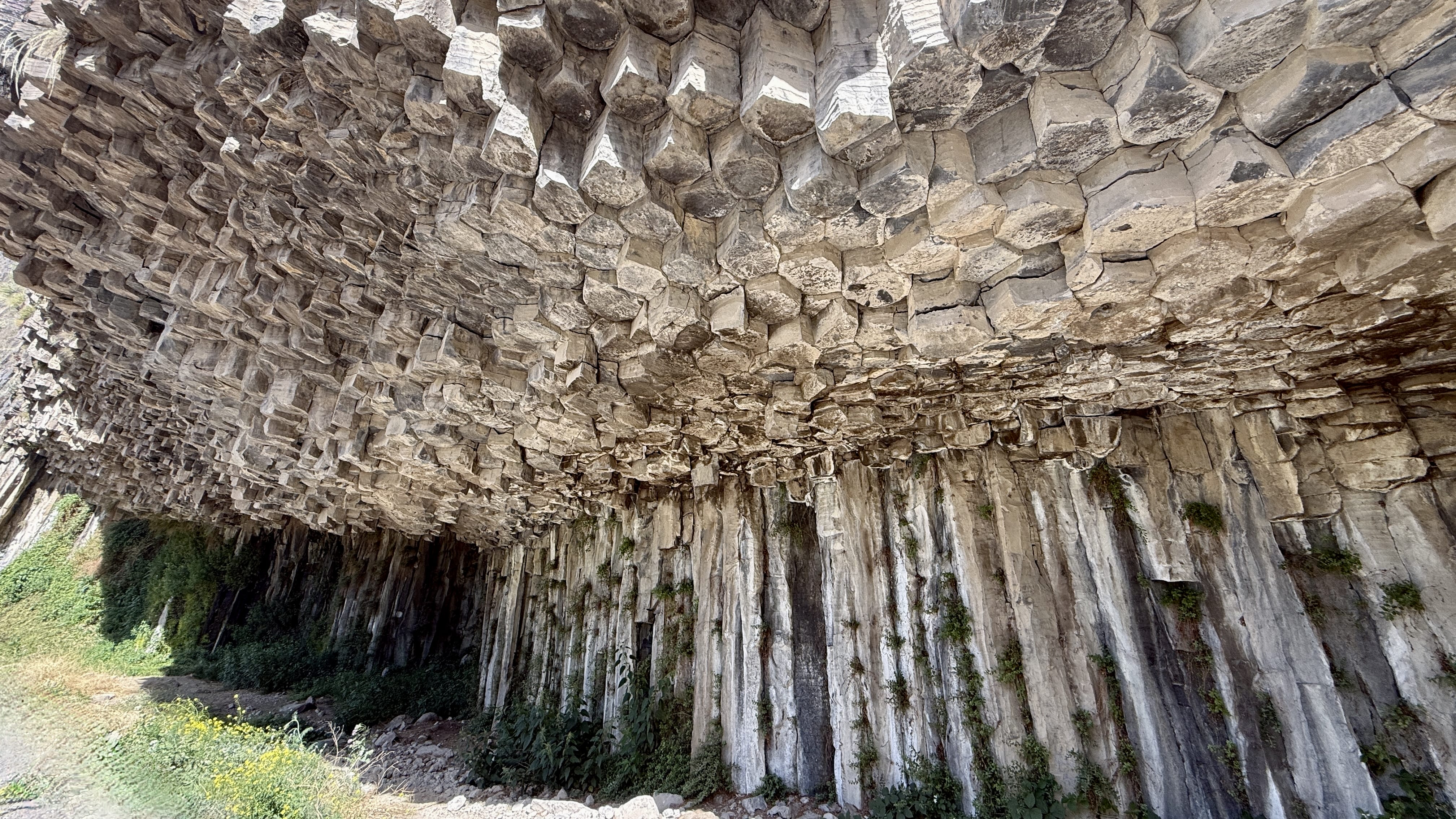 Overhanging basalt formations resembling organ pipes at the Symphony of Stones near Garni, Armenia.