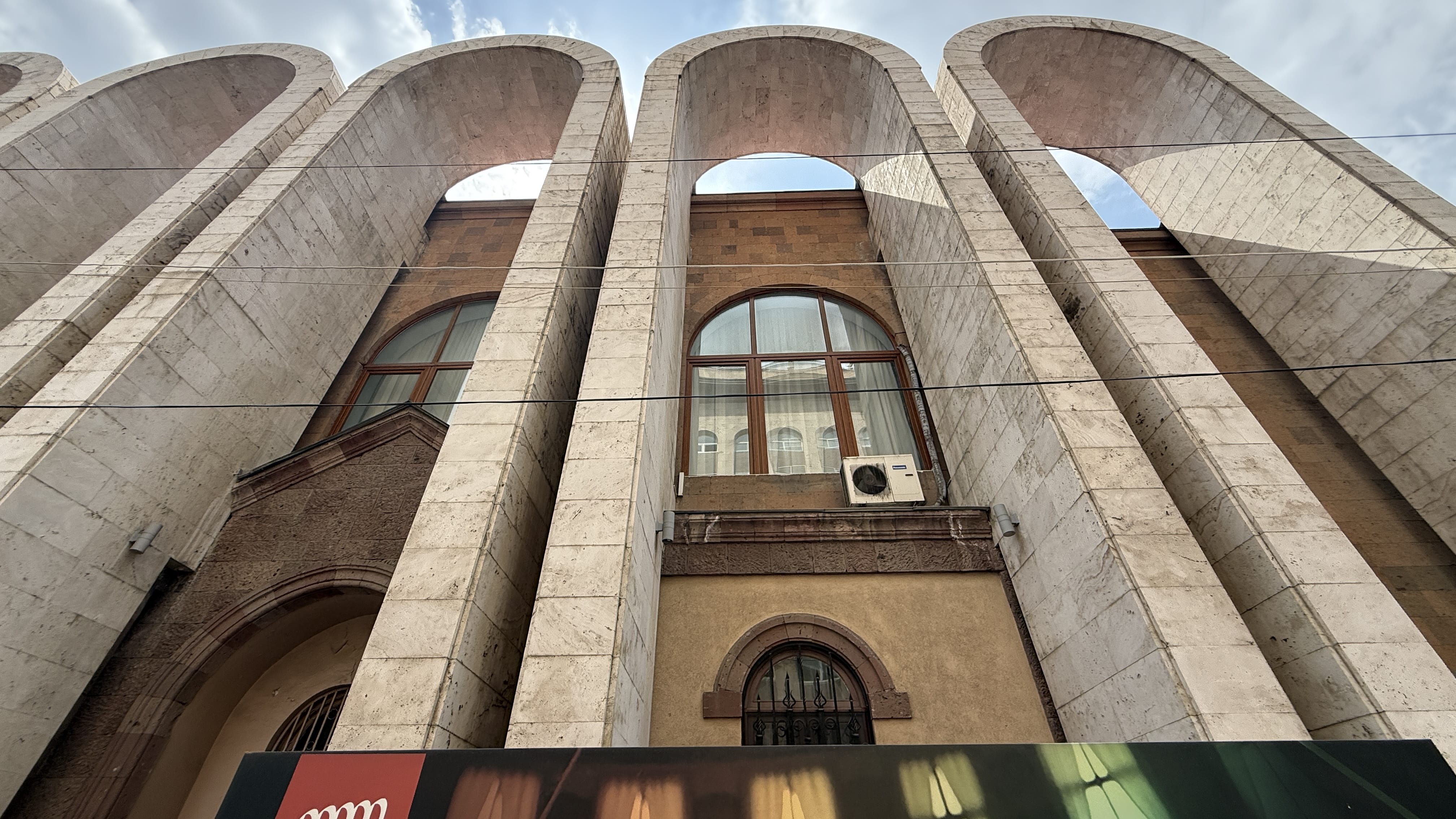 Exterior of Aram Khachaturian Museum with tall arches, 24 hours in Yerevan