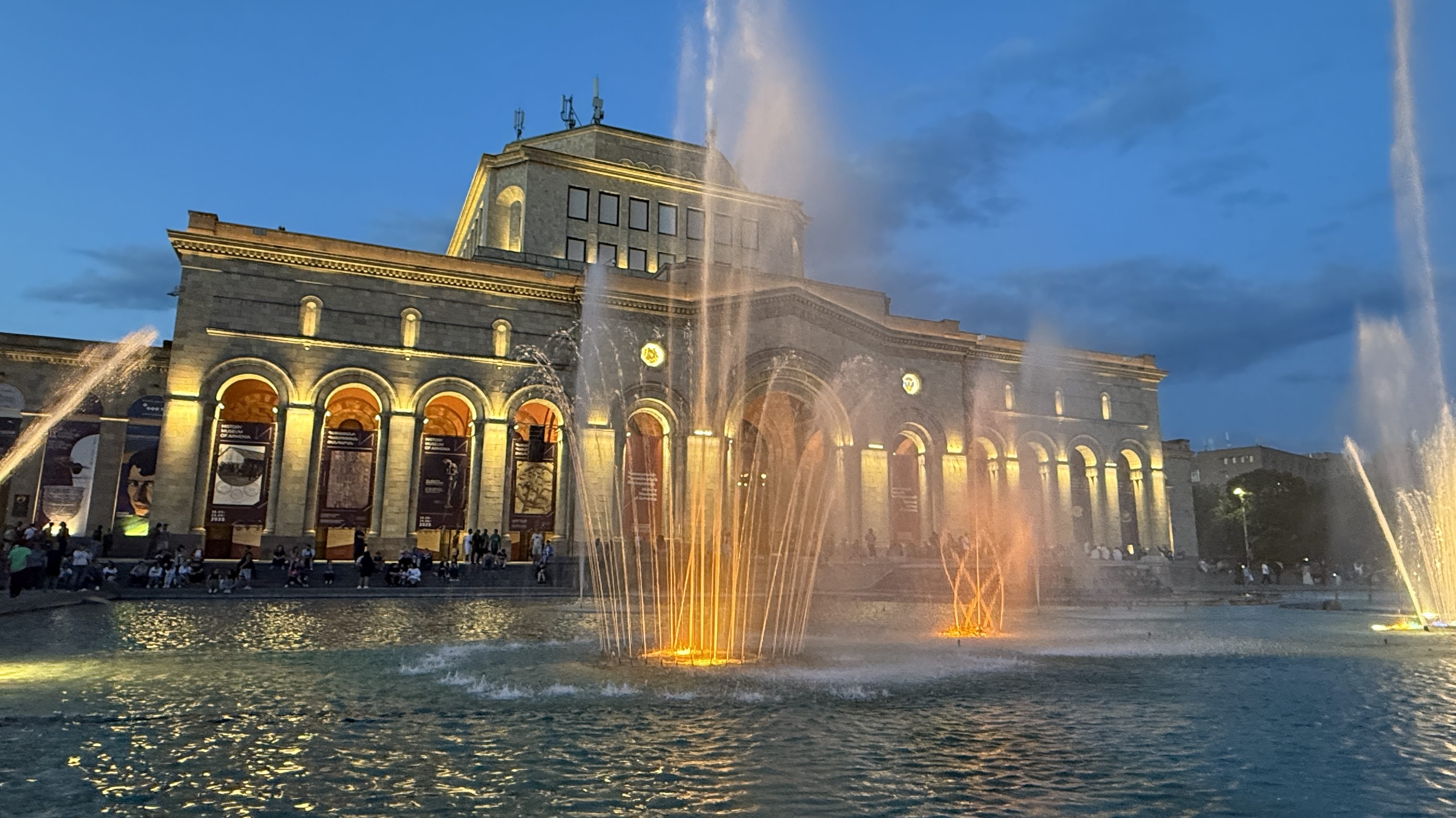 Colorful illuminated fountains at night in front of the History Museum of Armenia at Republic Square in Yerevan.