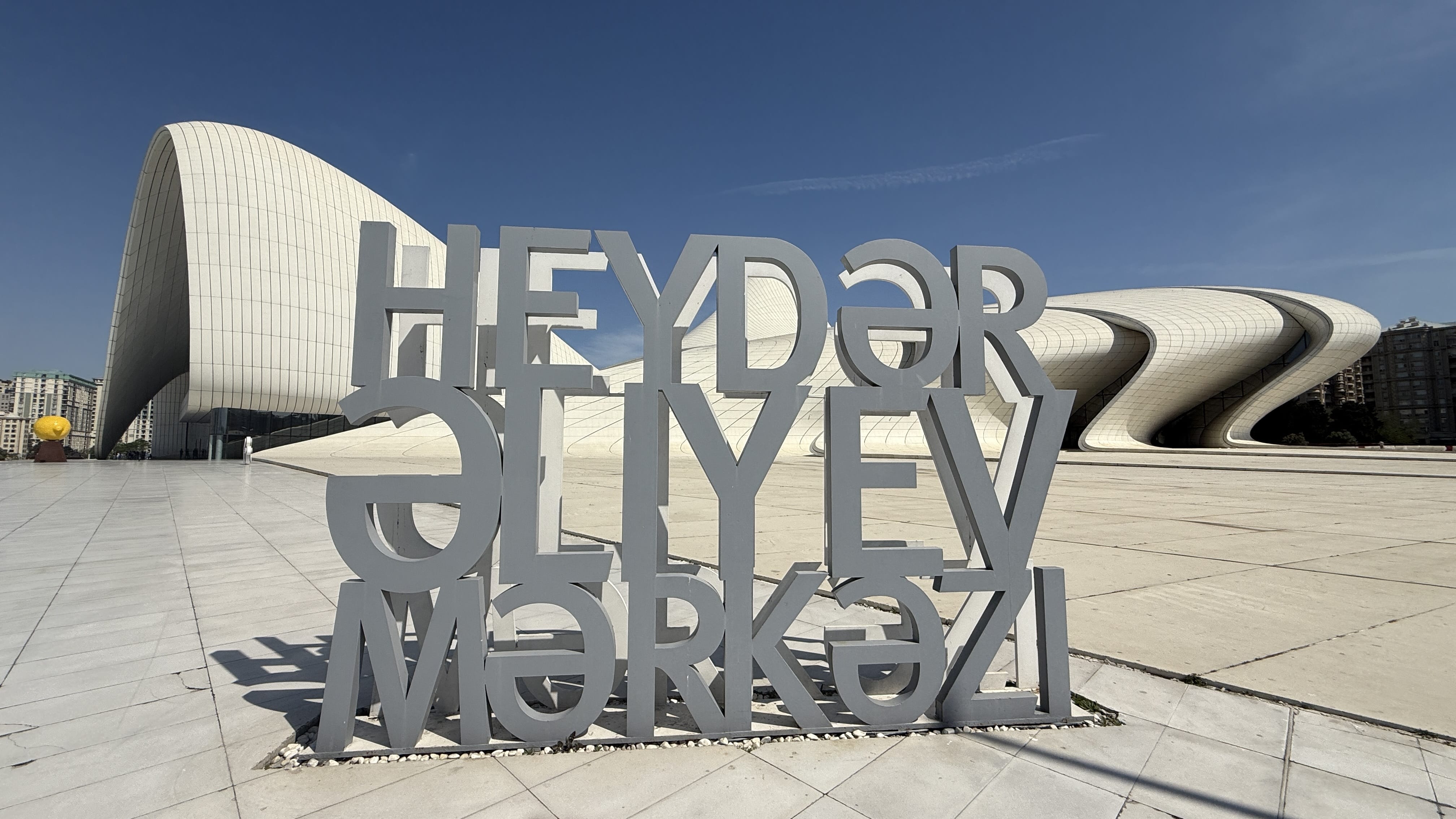 Modern architectural design of Heydar Aliyev Center with sculptural lettering in Baku, Azerbaijan — 7 Days in Azerbaijan sightseeing.