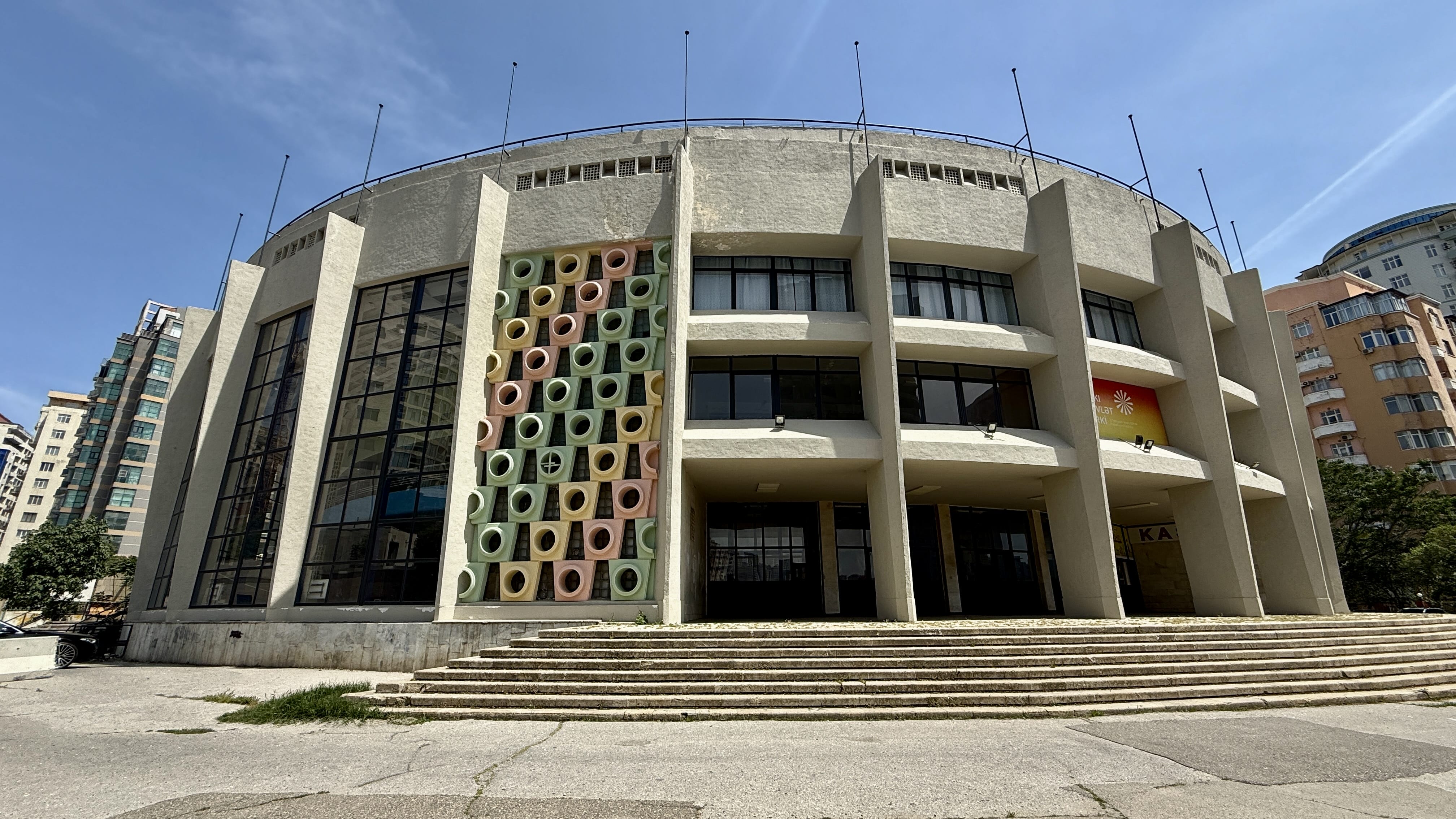 Exterior of the Baku State Circus building with colorful circular concrete designs on the facade — 2 Days in Baku Soviet architecture.