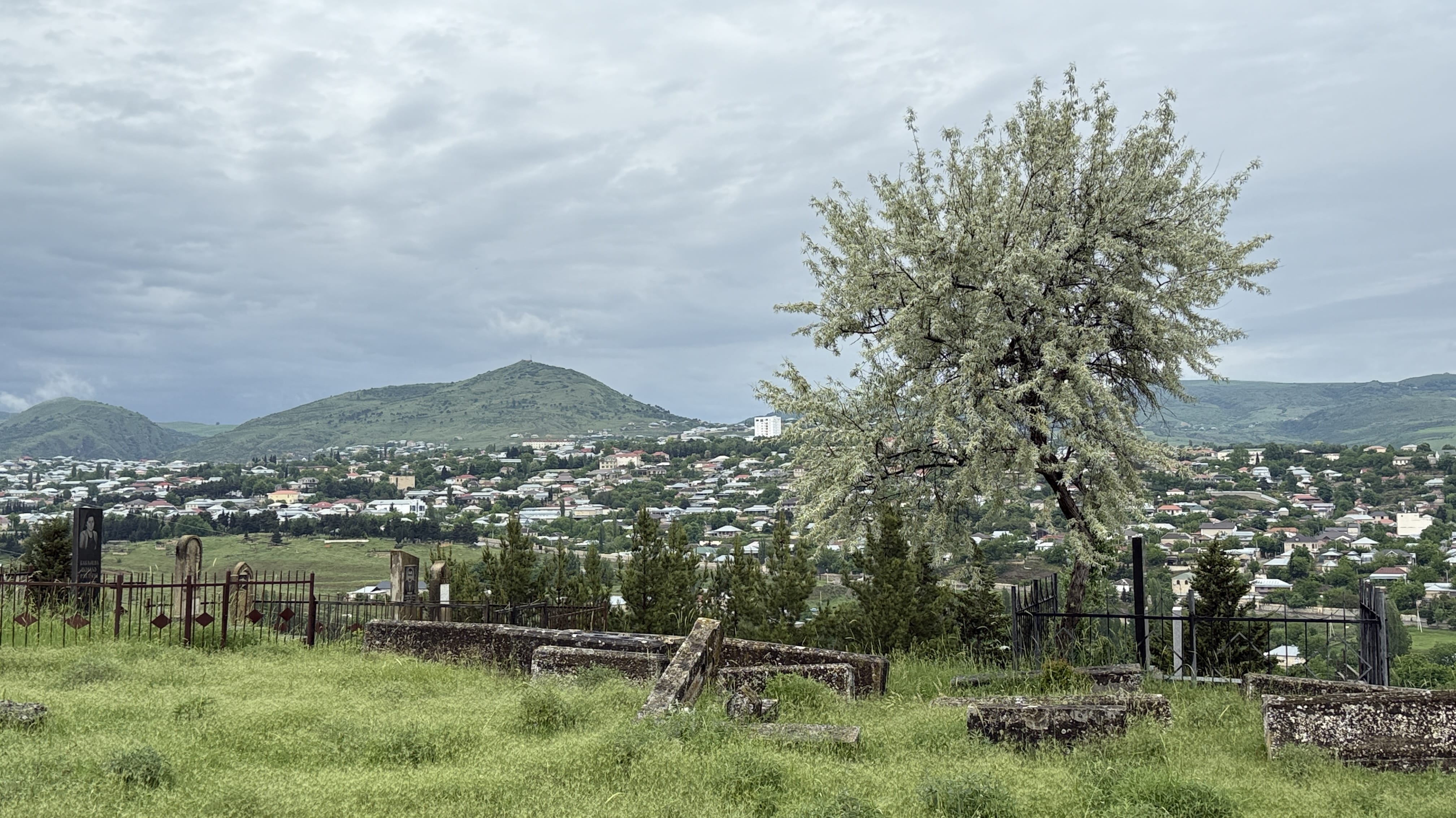View over the city of Shamakhi from Yeddi Gumbaz Mausoleum hilltop cemetery in Azerbaijan during 7 Days in Azerbaijan.