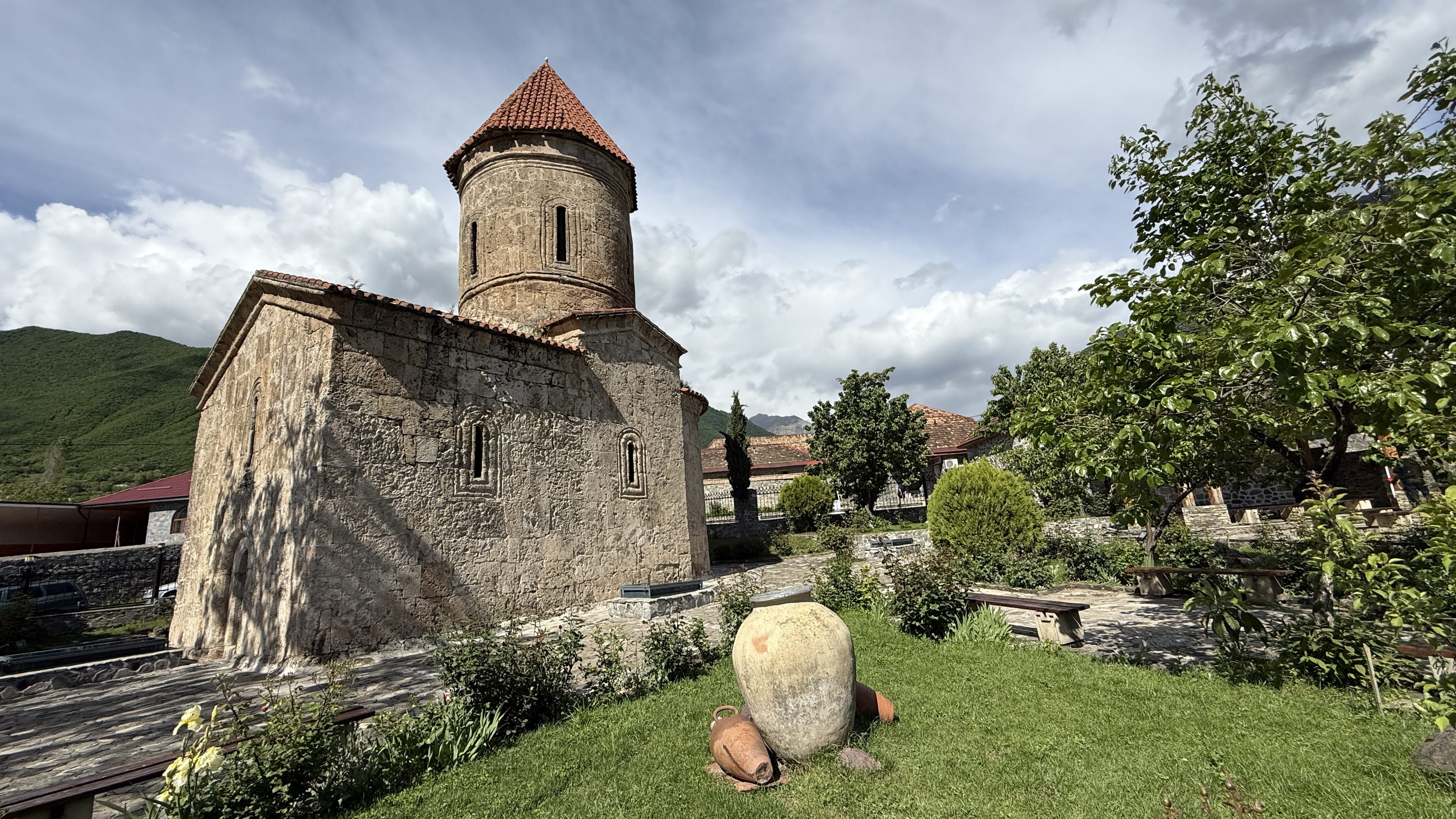 Exterior of the Albanian Church of Kish with stone walls and a red-tiled dome, photographed during my 7 Days in Azerbaijan trip.
