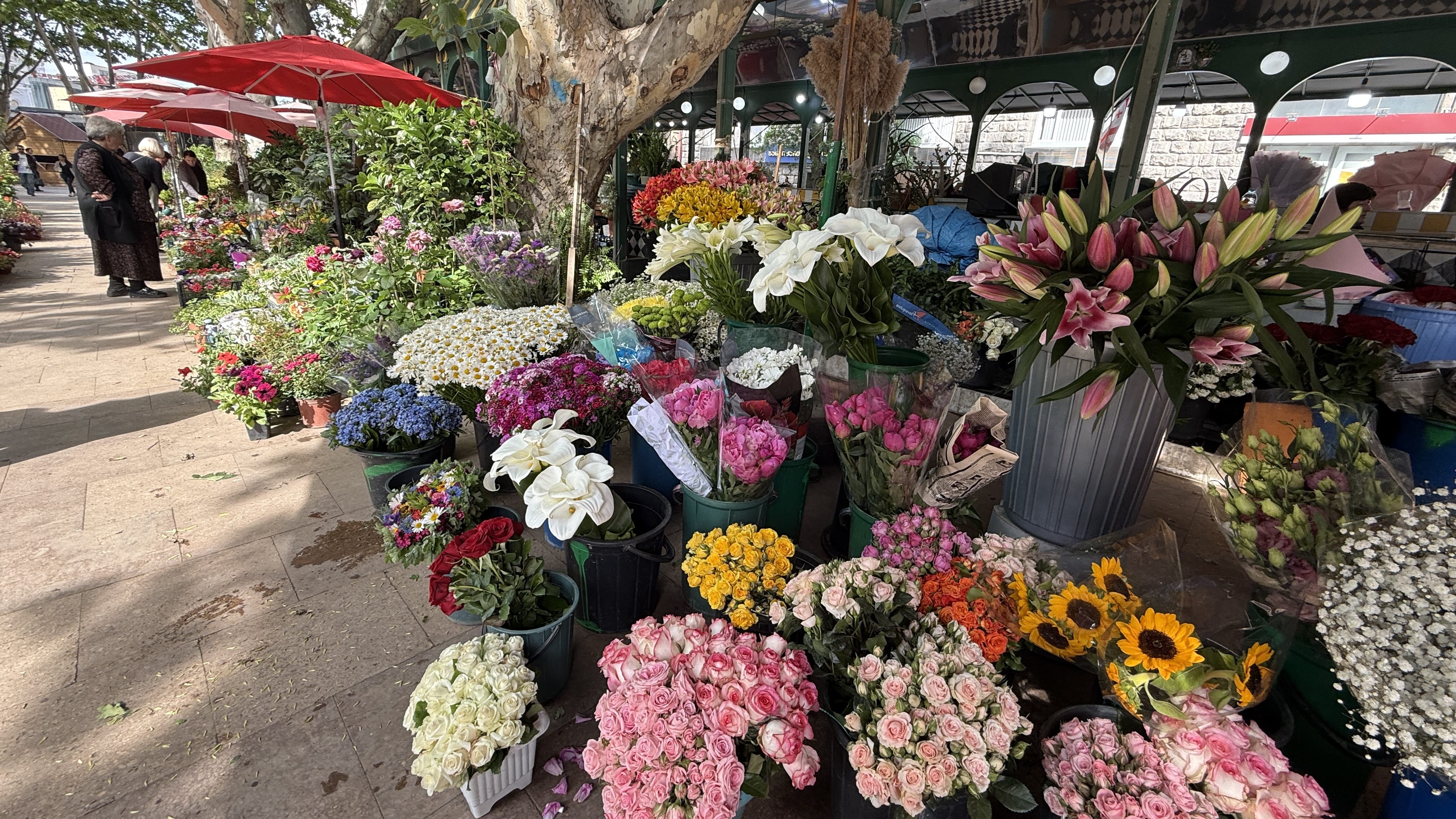 Flower market at Orbeliani Square in Tbilisi with colorful bouquets and vendors