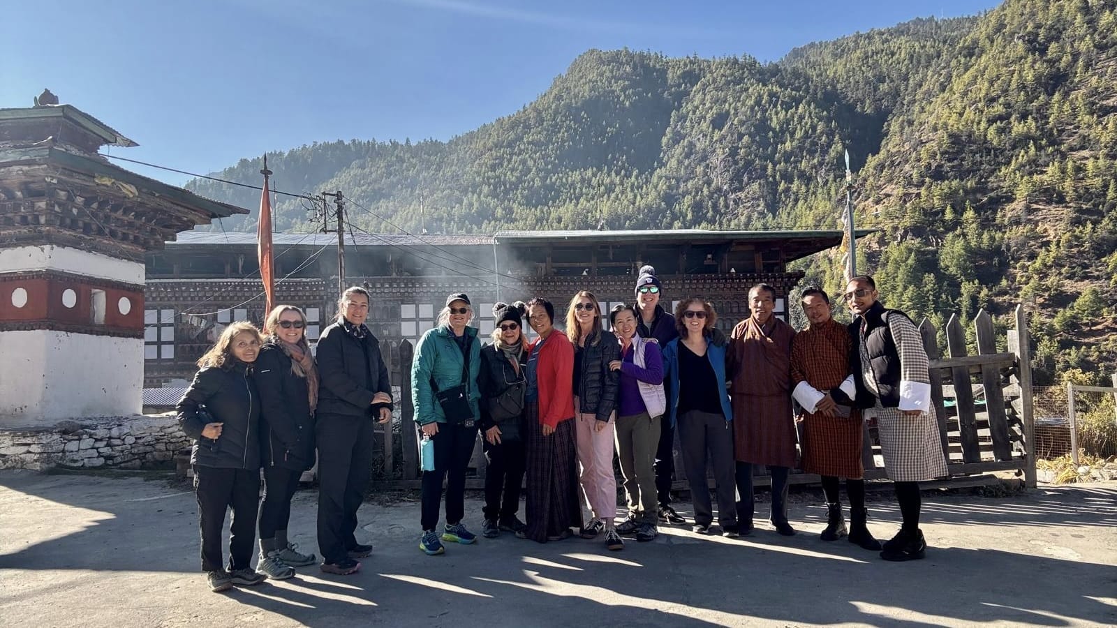 Group photo with our hosts in the Haa Valley, Bhutan, taken outside a traditional farmhouse before departing.