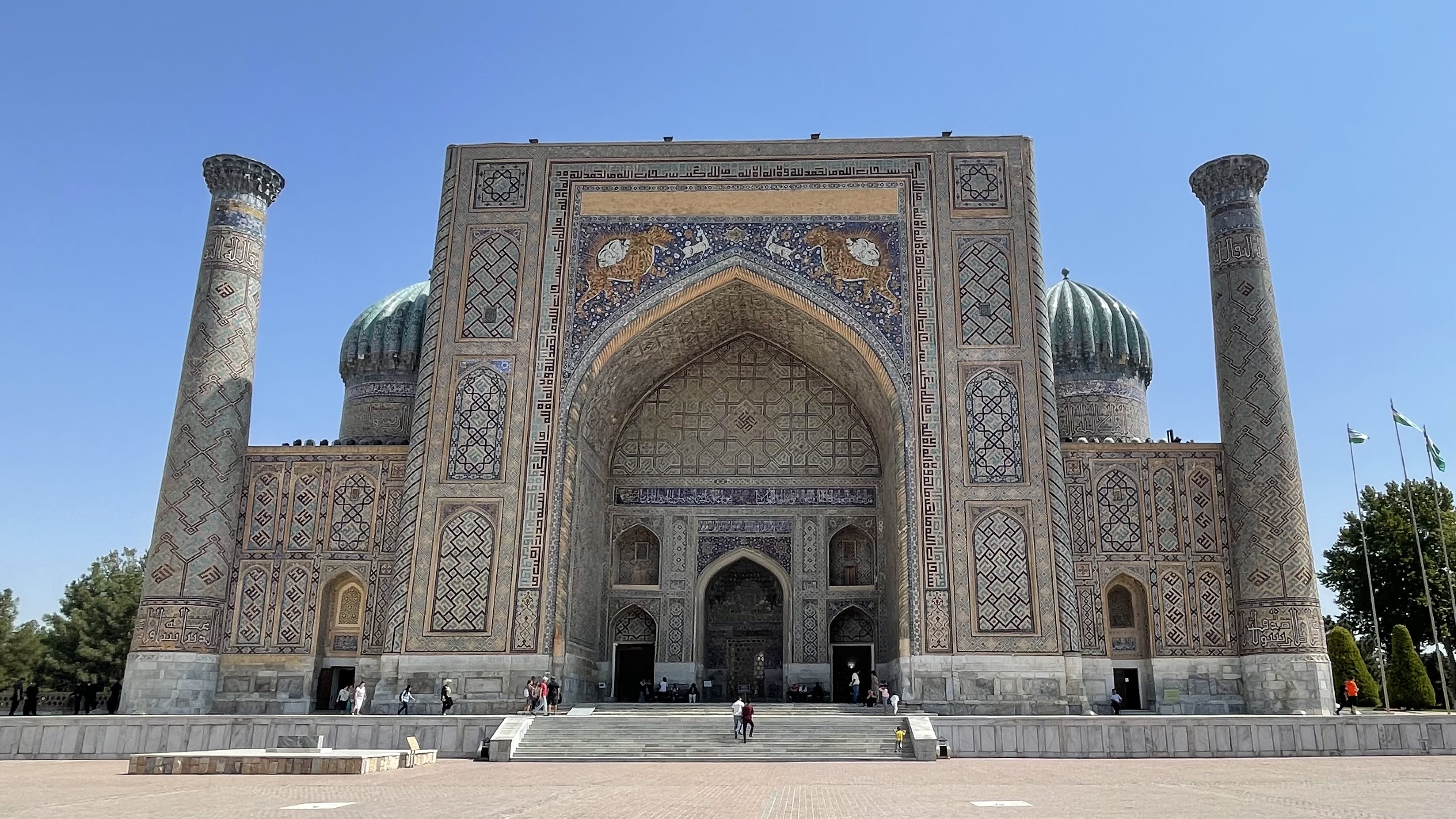Sher-Dor Madrasah at Registan Square in Samarkand, Uzbekistan, featuring the iconic tiger mosaics above the main entrance during a 4 days in Uzbekistan itinerary.
