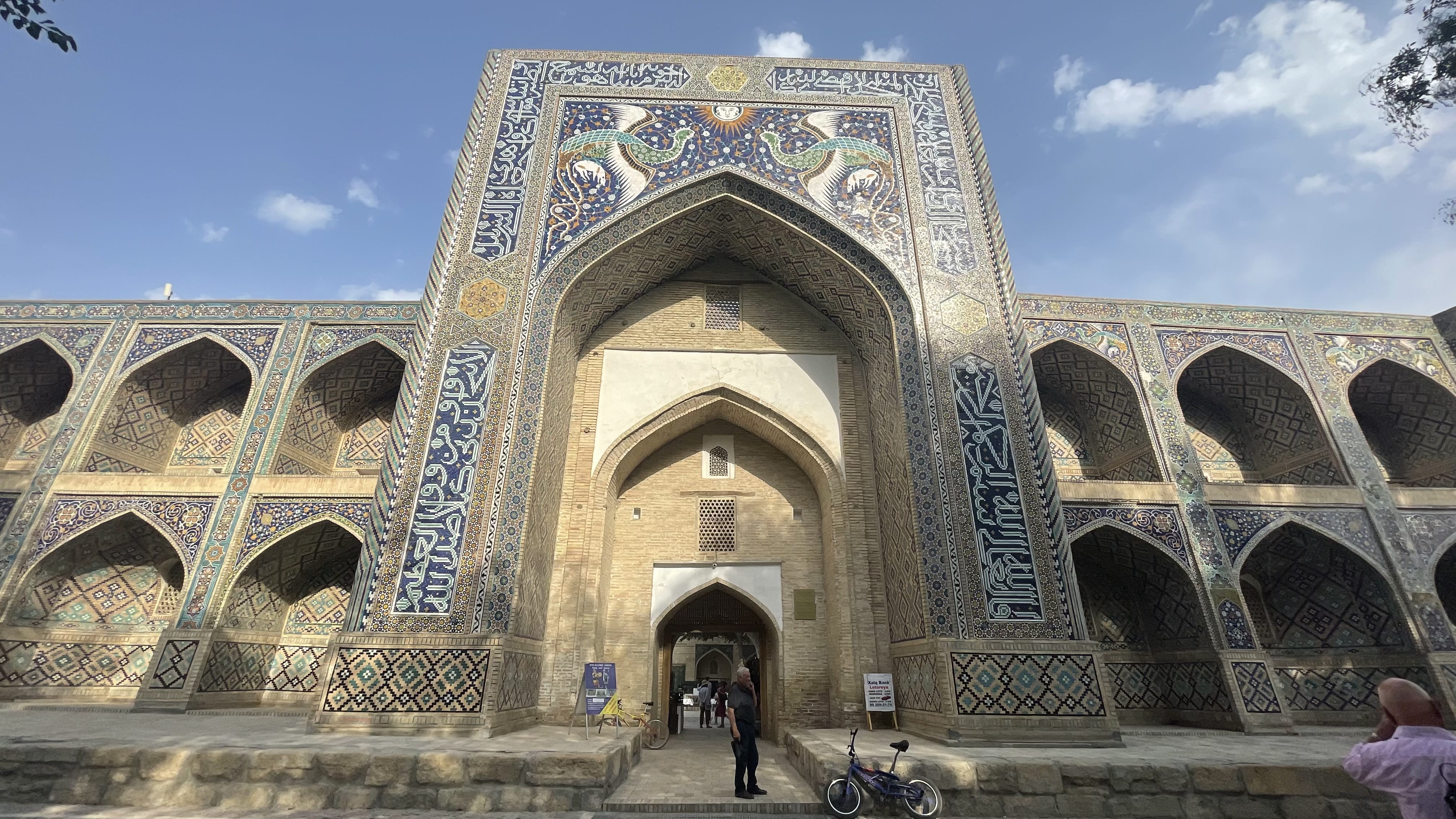 Nodir Devon Begi Madrasah in Bukhara, Uzbekistan, featuring the distinctive bird mosaics above the entrance, photographed during a 4 days in Uzbekistan itinerary.