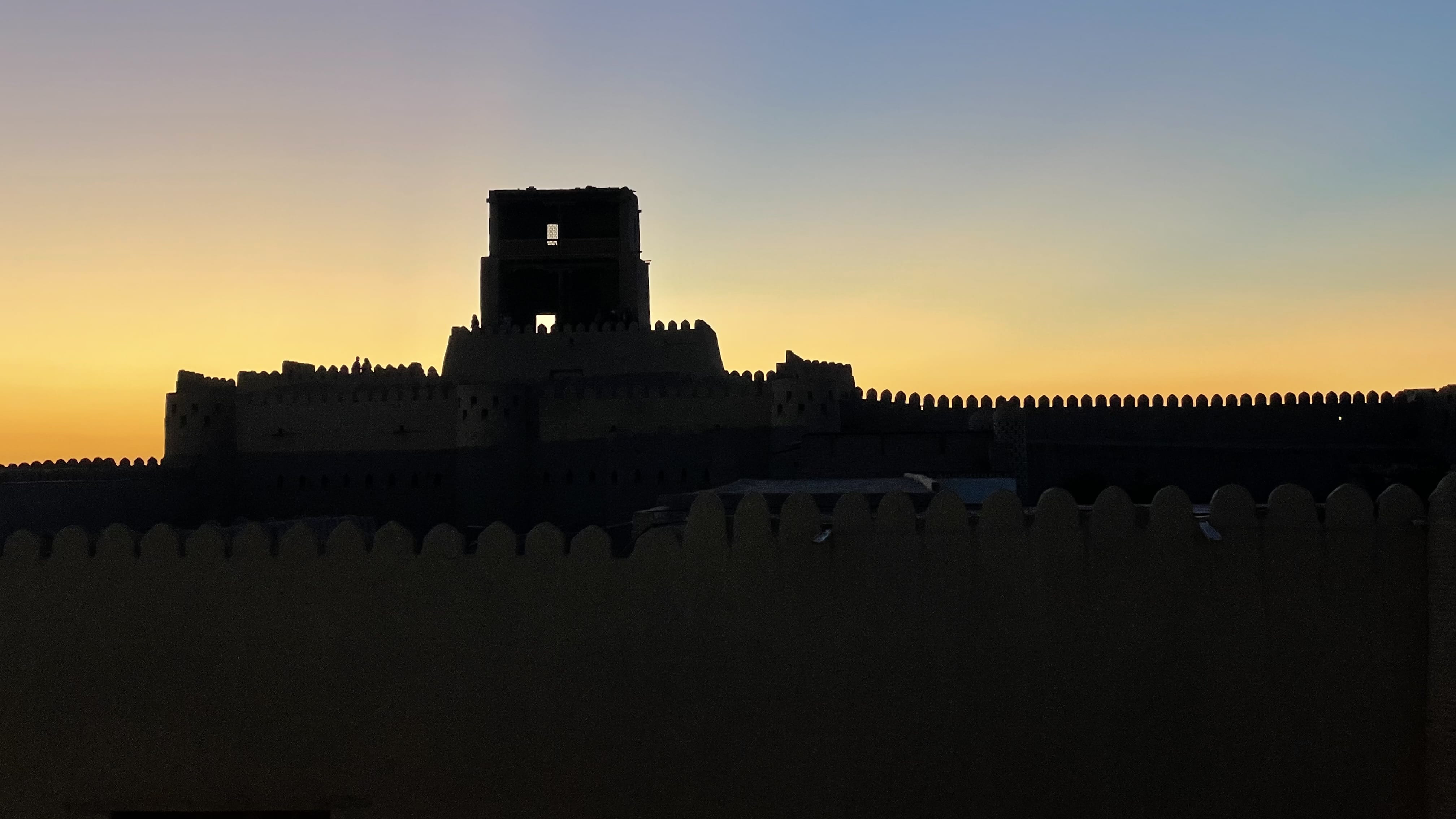 Sunset silhouette of the mud-brick walls inside Itchan Kala, Khiva, Uzbekistan, photographed during a 4 days in Uzbekistan itinerary.