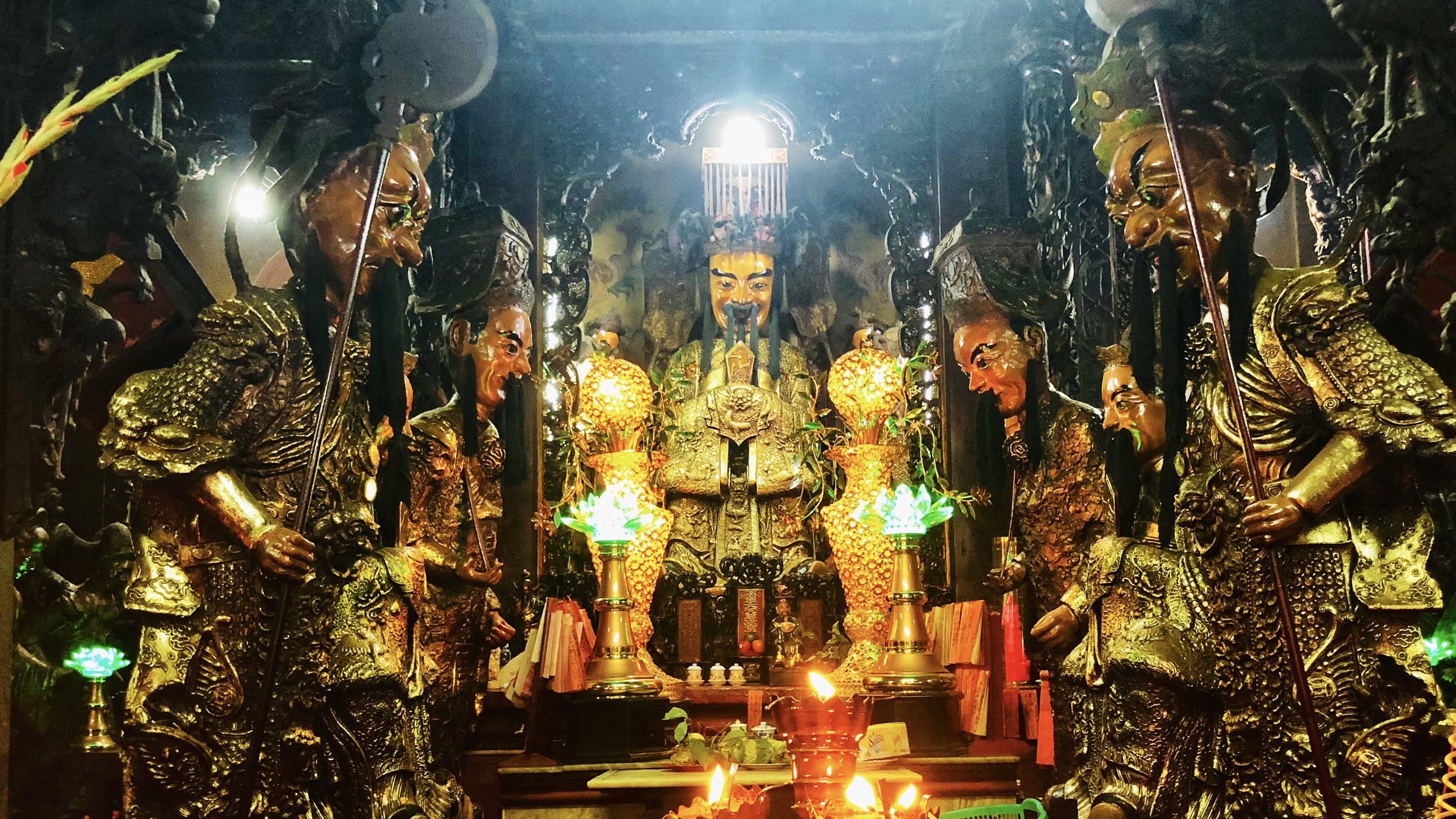 Ornate Jade Emperor Pagoda interior with golden statues and candles in Ho Chi Minh City during six days in Vietnam