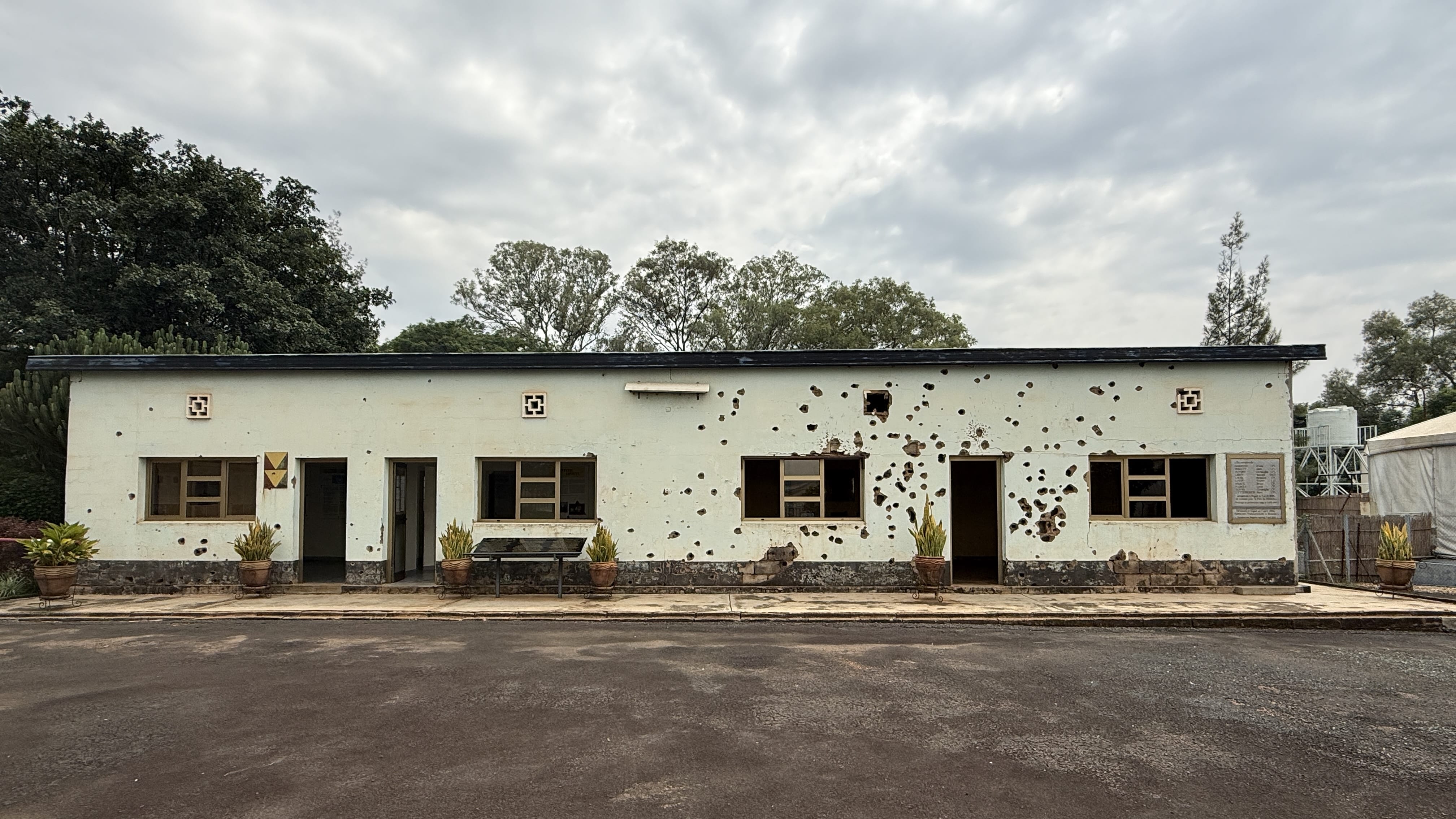 Bullet-scarred building at Camp Kigali Memorial in Kigali Rwanda