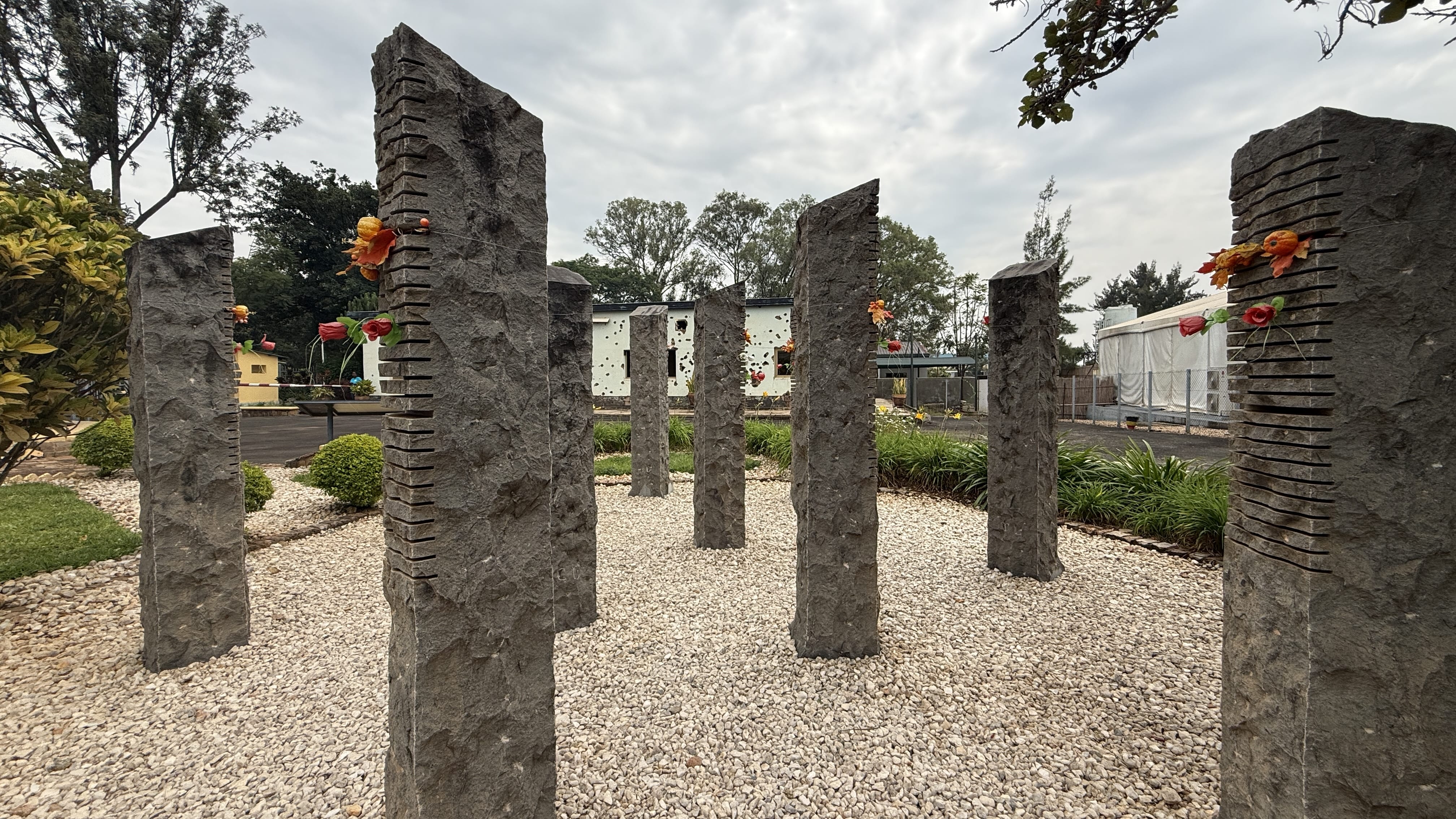 Stone memorial pillars honoring Belgian UN peacekeepers at Camp Kigali Memorial Rwanda