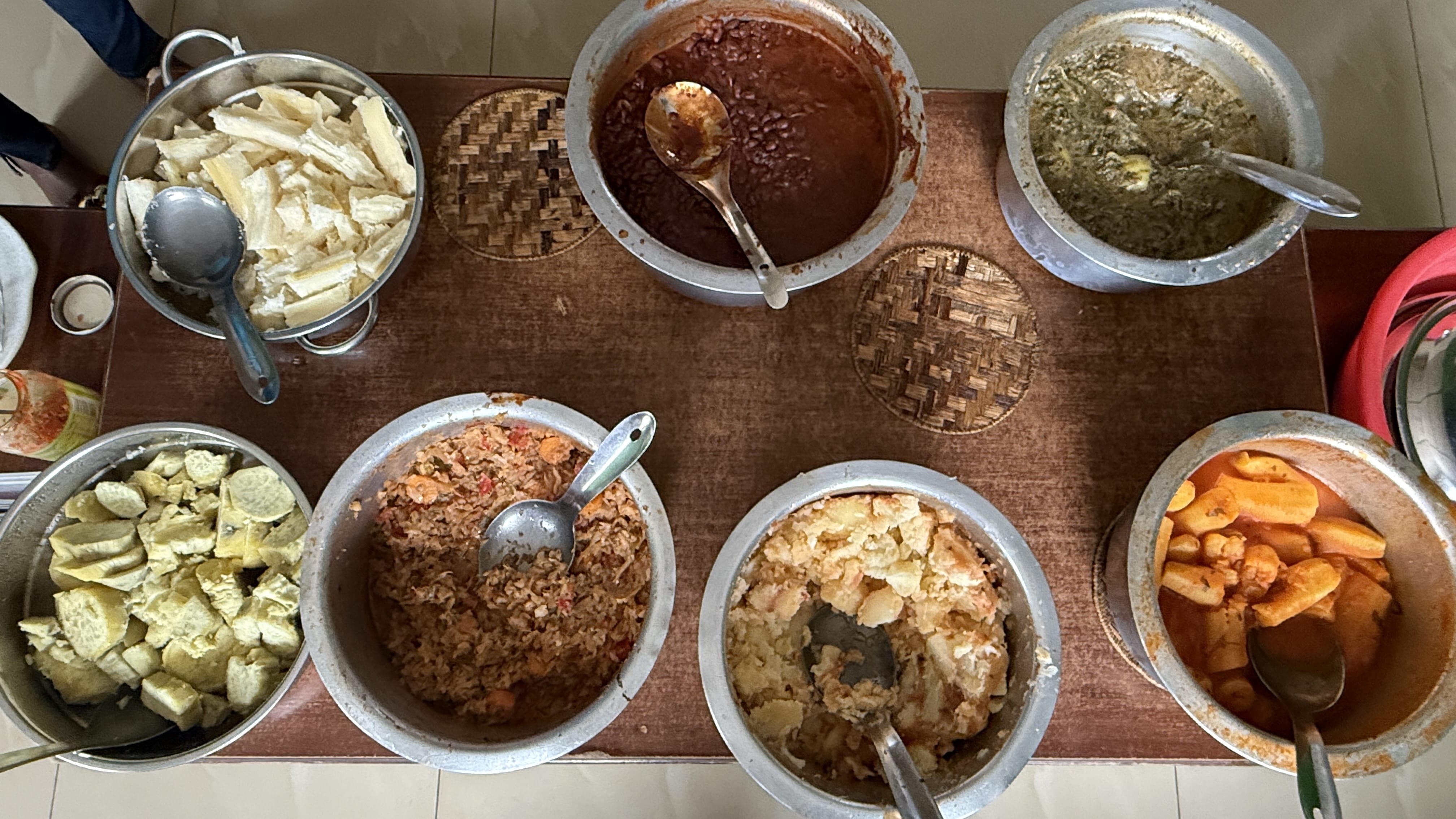 Traditional Rwandan buffet with beans, vegetables, cassava and sauces in Kigali Rwanda