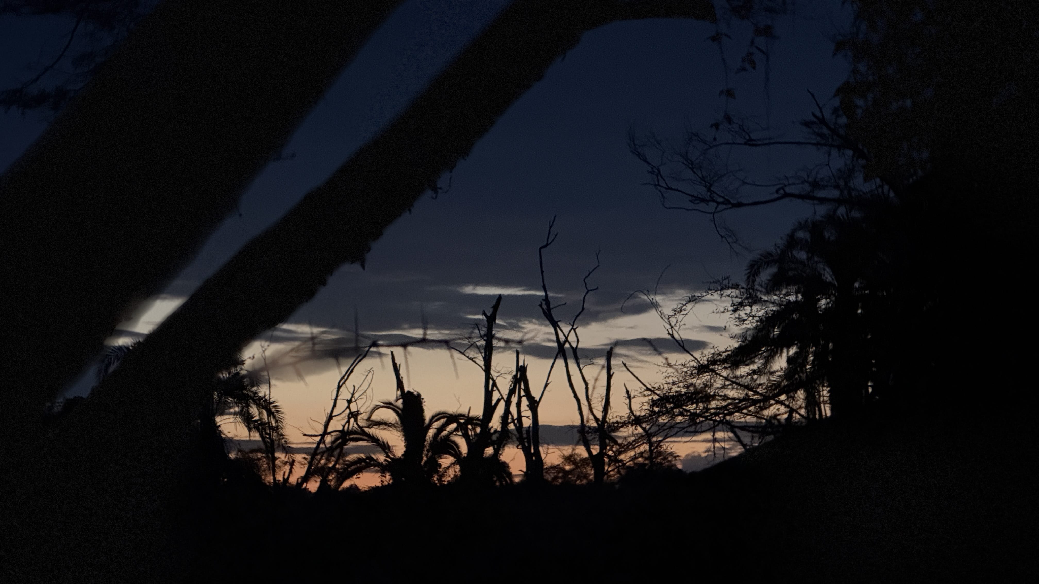 Uganda at dusk — layered hills, fading light, and the kind of silence you carry home with you.