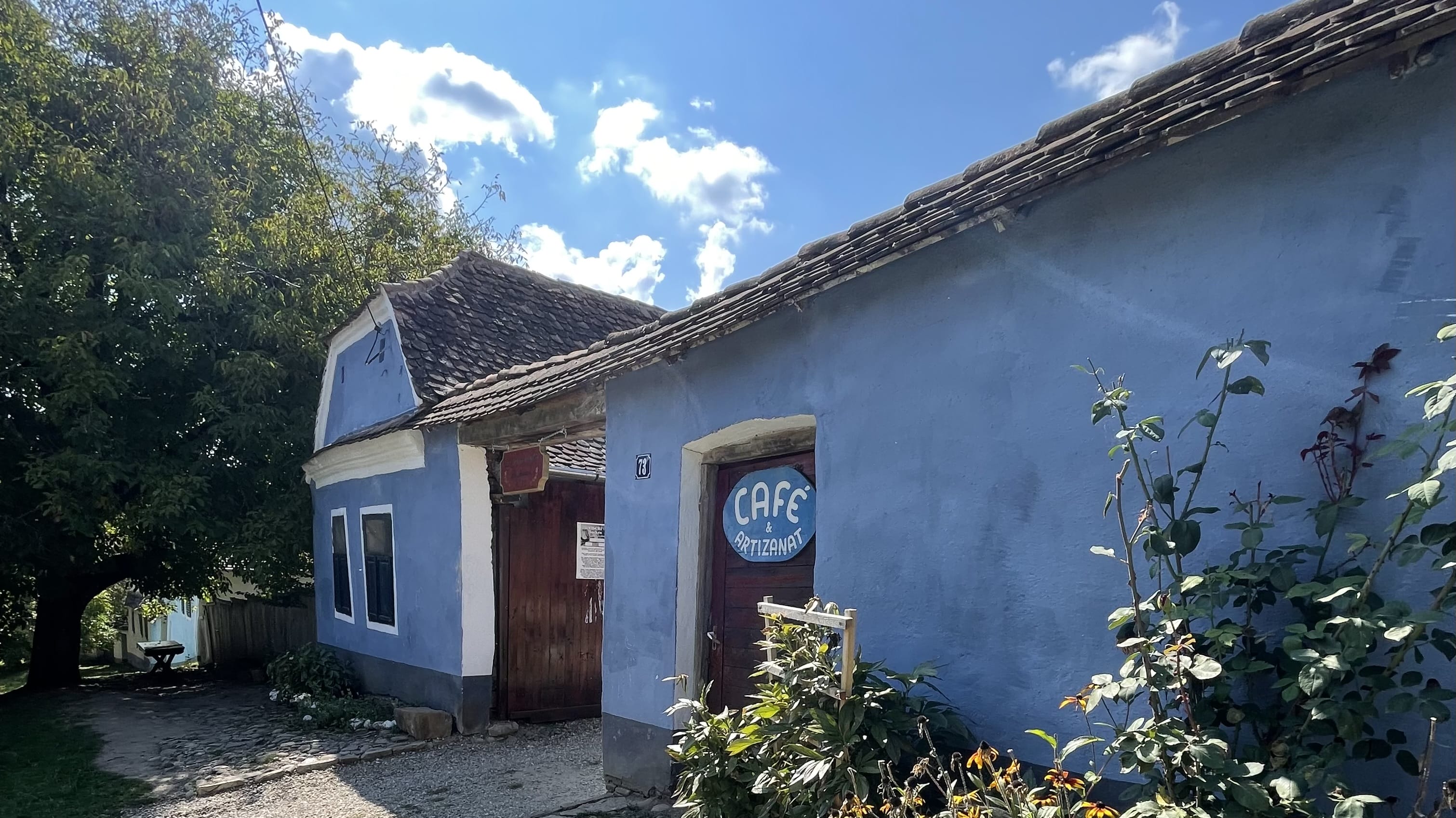 Traditional blue-painted Saxon house housing a café in Viscri, Transylvania, Romania.