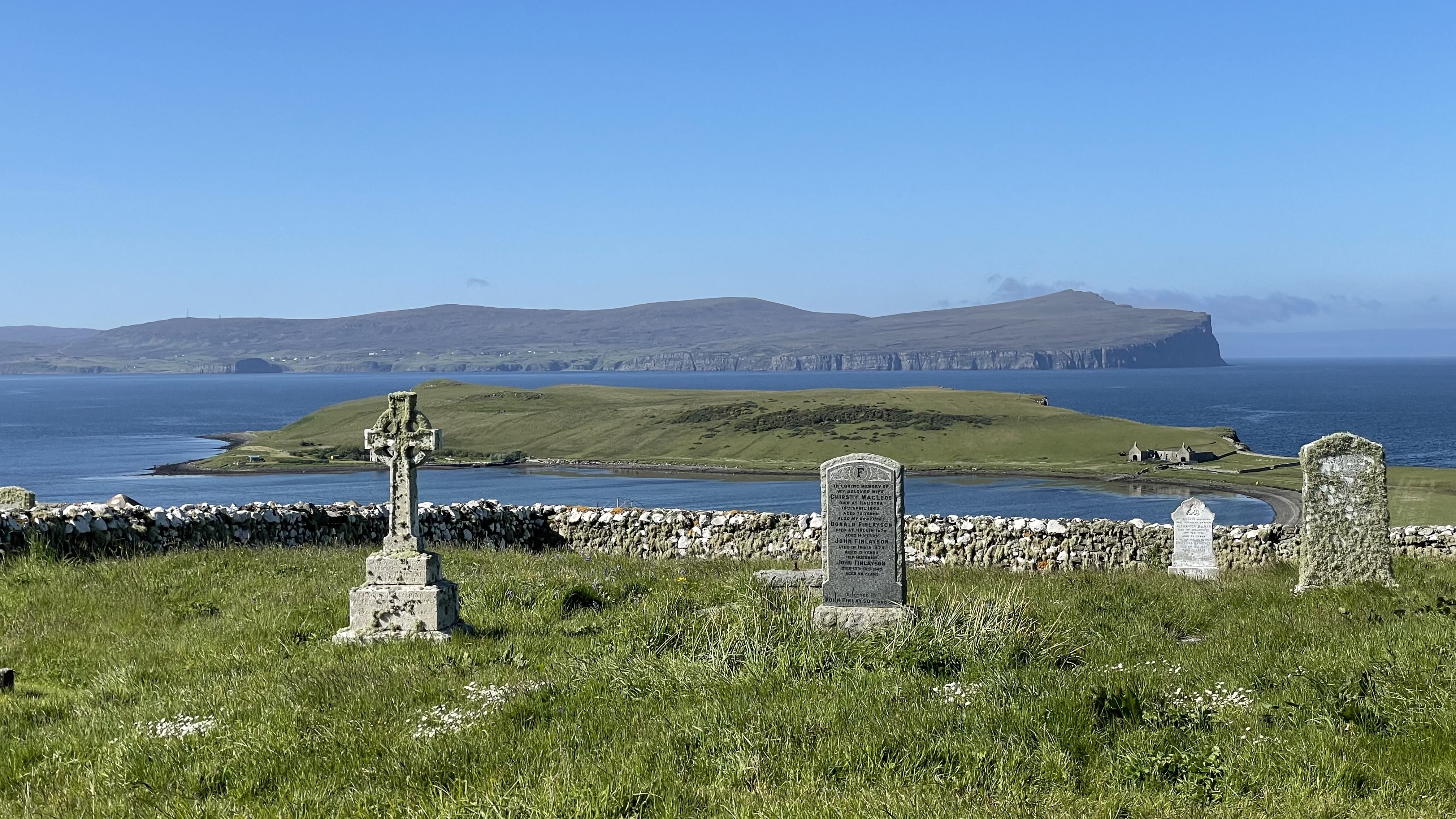 gravestones overlooking the Minch toward the Outer Hebrides on the Isle of Skye