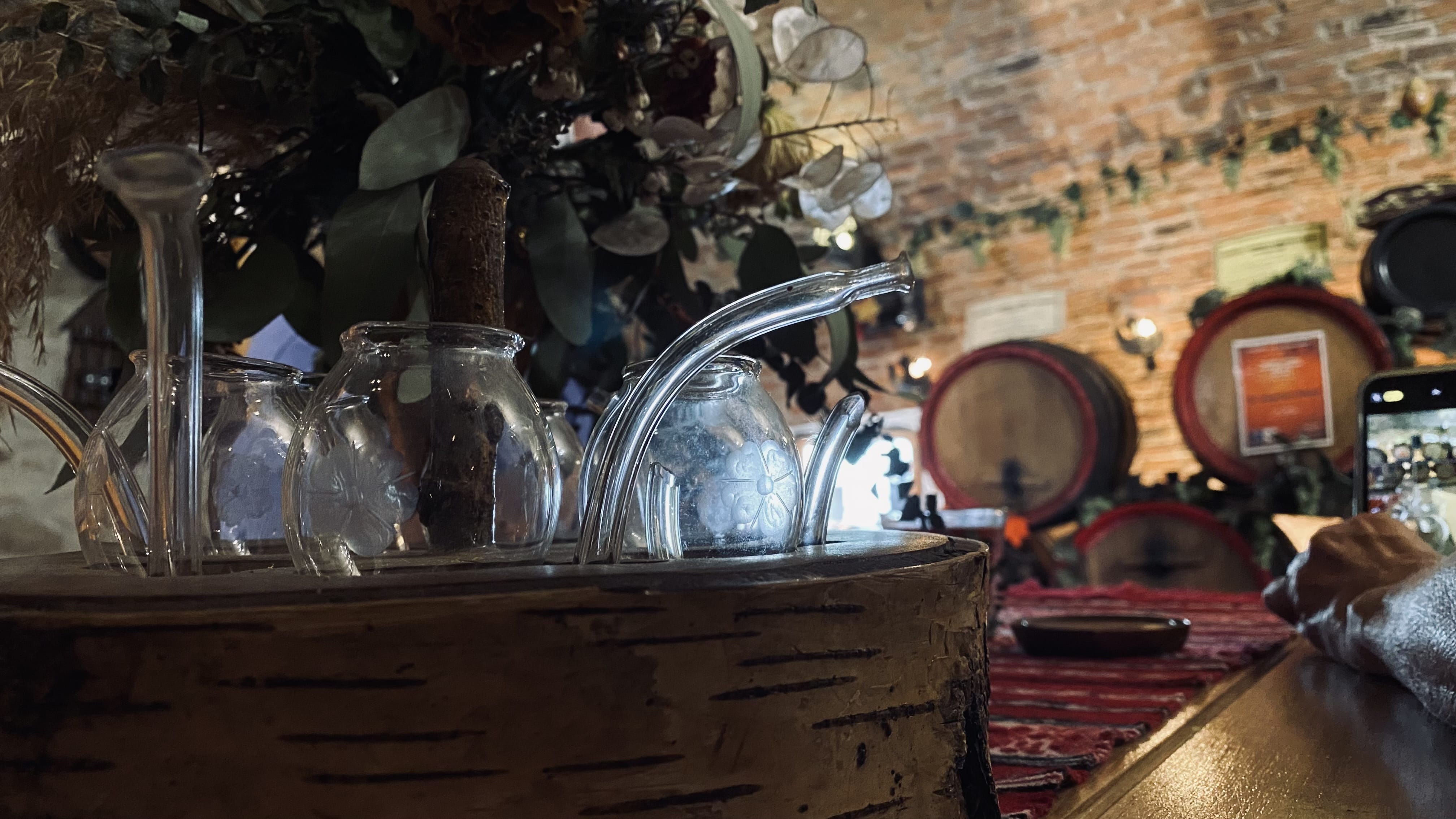 Interior of Pivnița lui Teo during a traditional Romanian liquor tasting in Sighișoara.