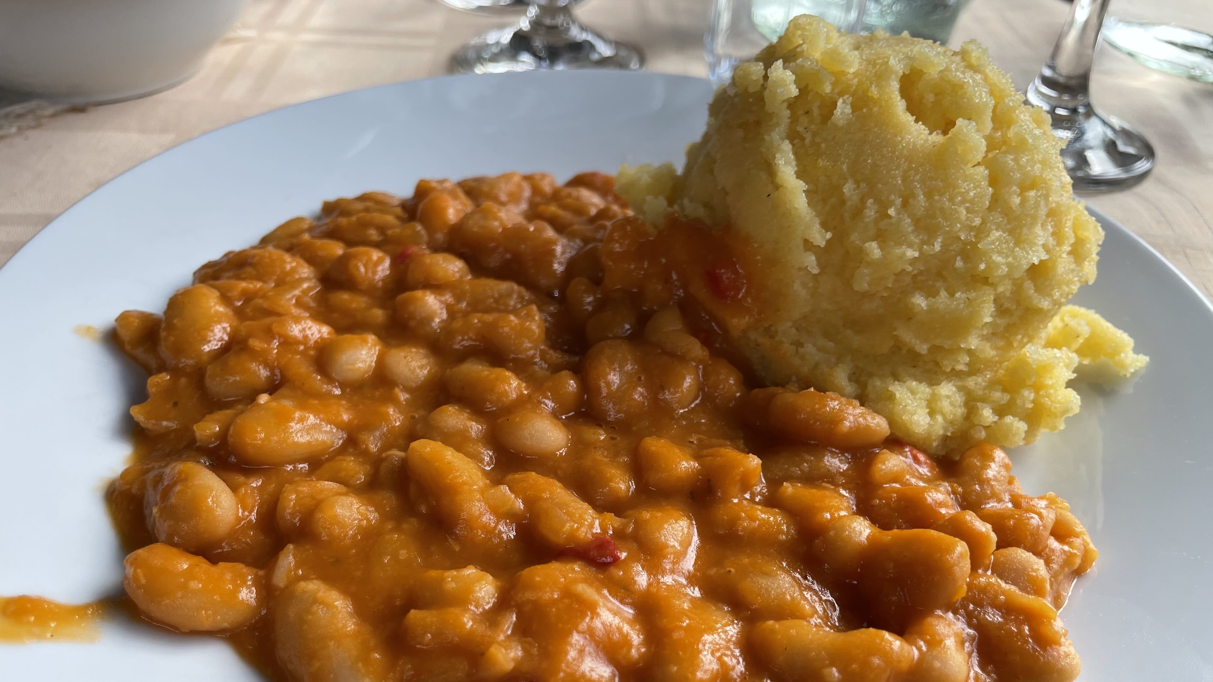 Bean stew served with creamy polenta at a restaurant near Sibiu, Romania.