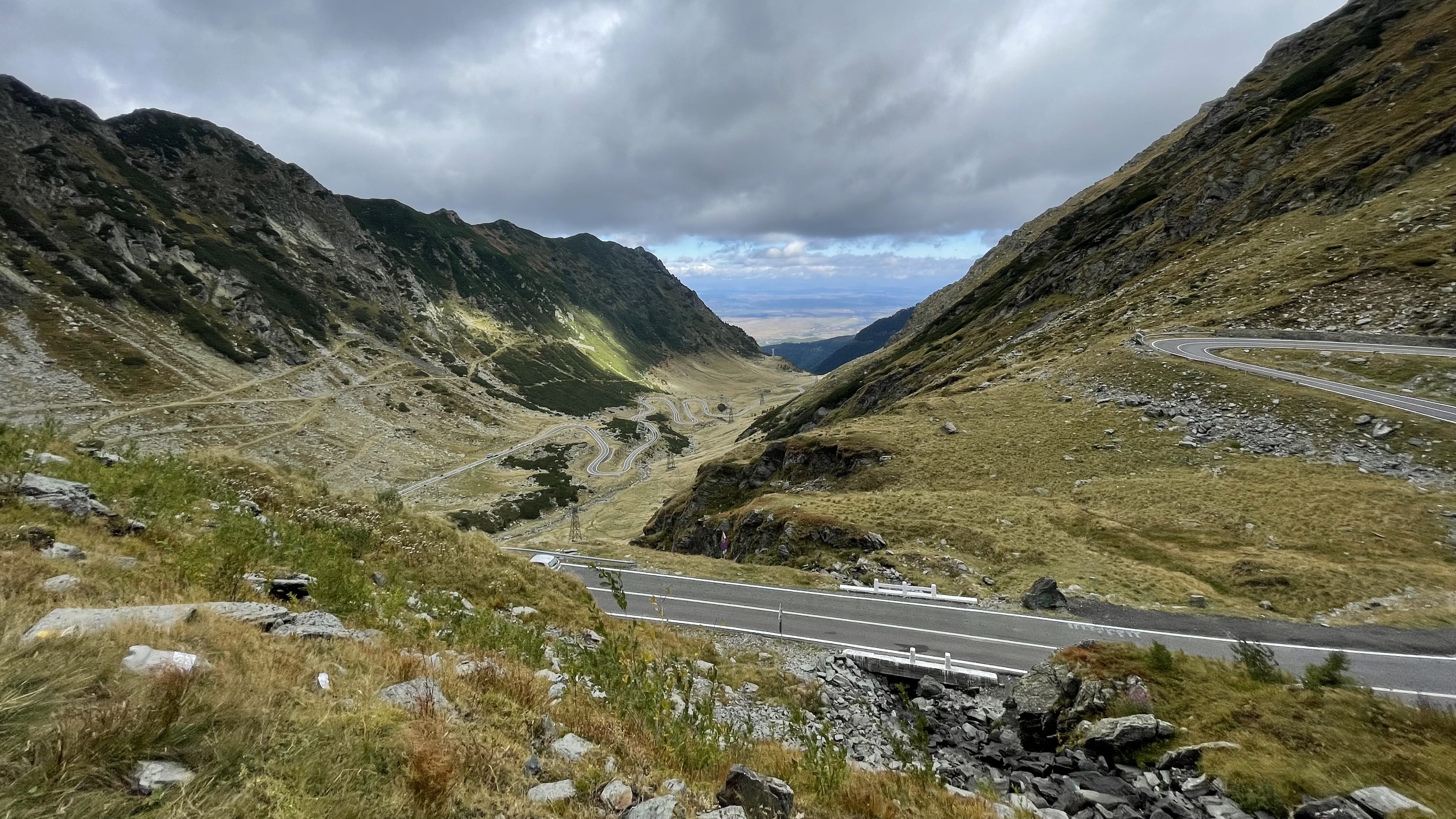 Sweeping view of the winding Transfăgărășan Highway through Romania's Făgăraș Mountains.