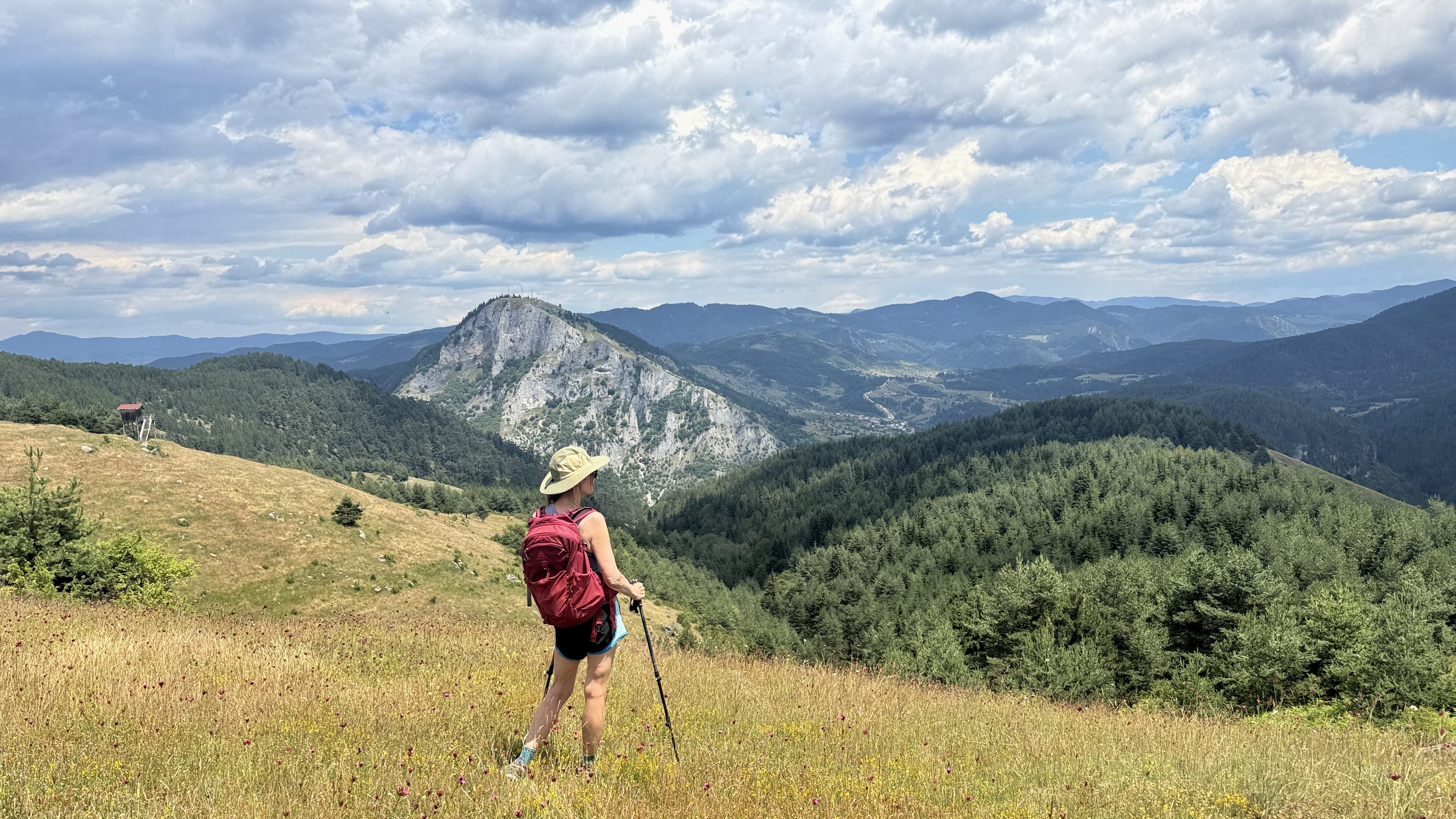 Hiker overlooking the mountains while hiking in Bulgaria’s Rhodope Mountains