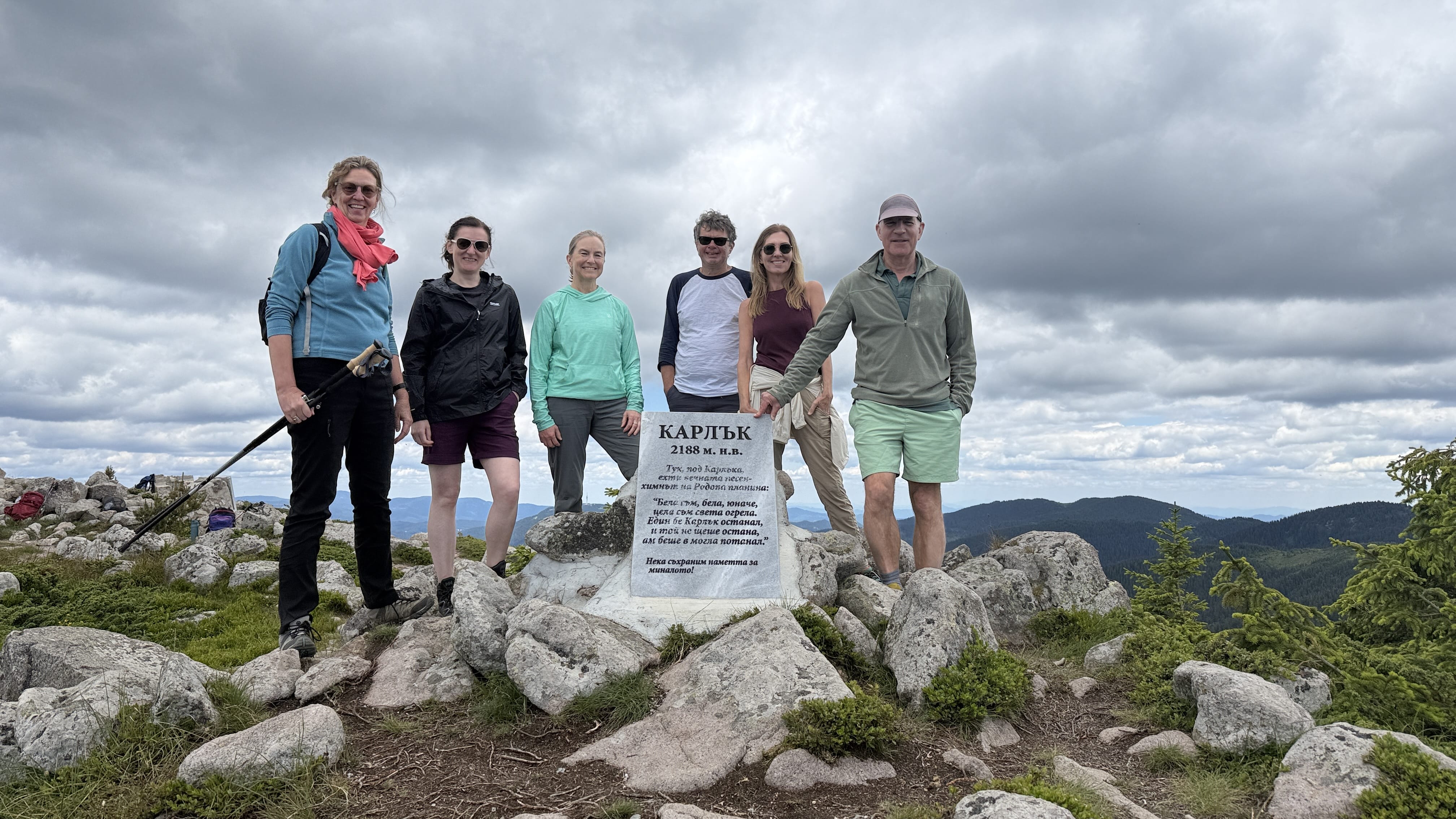 Hikers resting near Karlak Peak in Bulgaria’s Rhodope Mountains